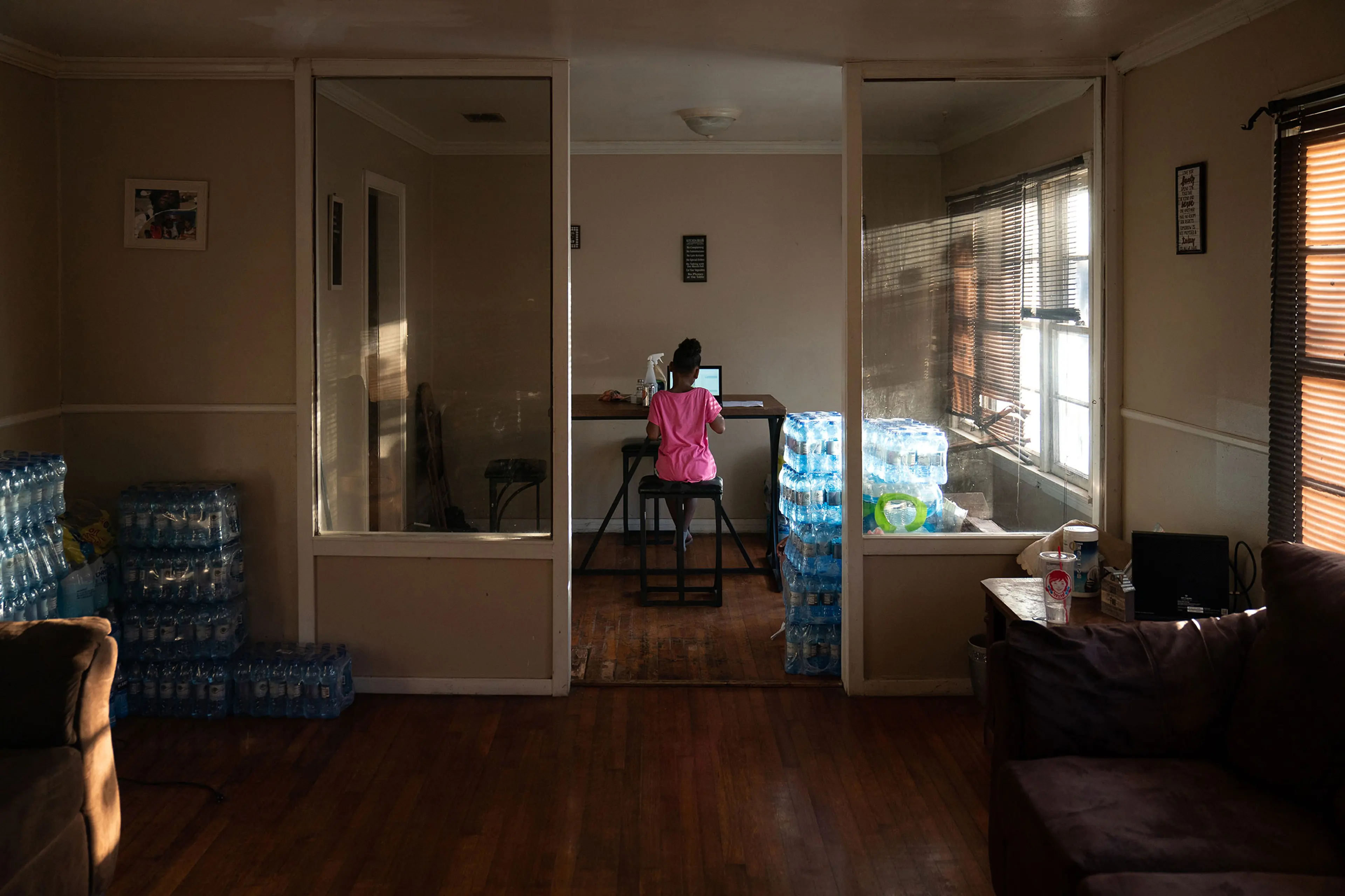 Ma’kayla Jackson uses a laptop in grandmother’s dining room in Jackson, Miss. on Jan. 5.