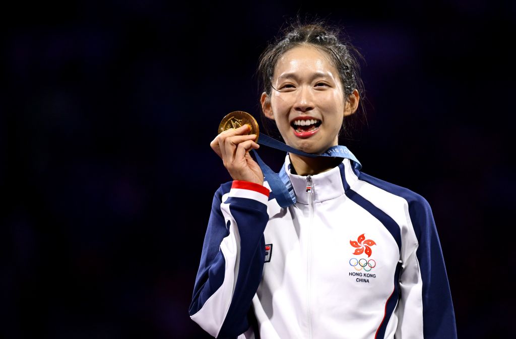 Gold medalist Vivian Kong Man Wai of China's Hong Kong poses for photos during the awarding ceremony for Women's Epee Individual at the Paris 2024 Olympic Games in Paris, France, on July 27, 2024.