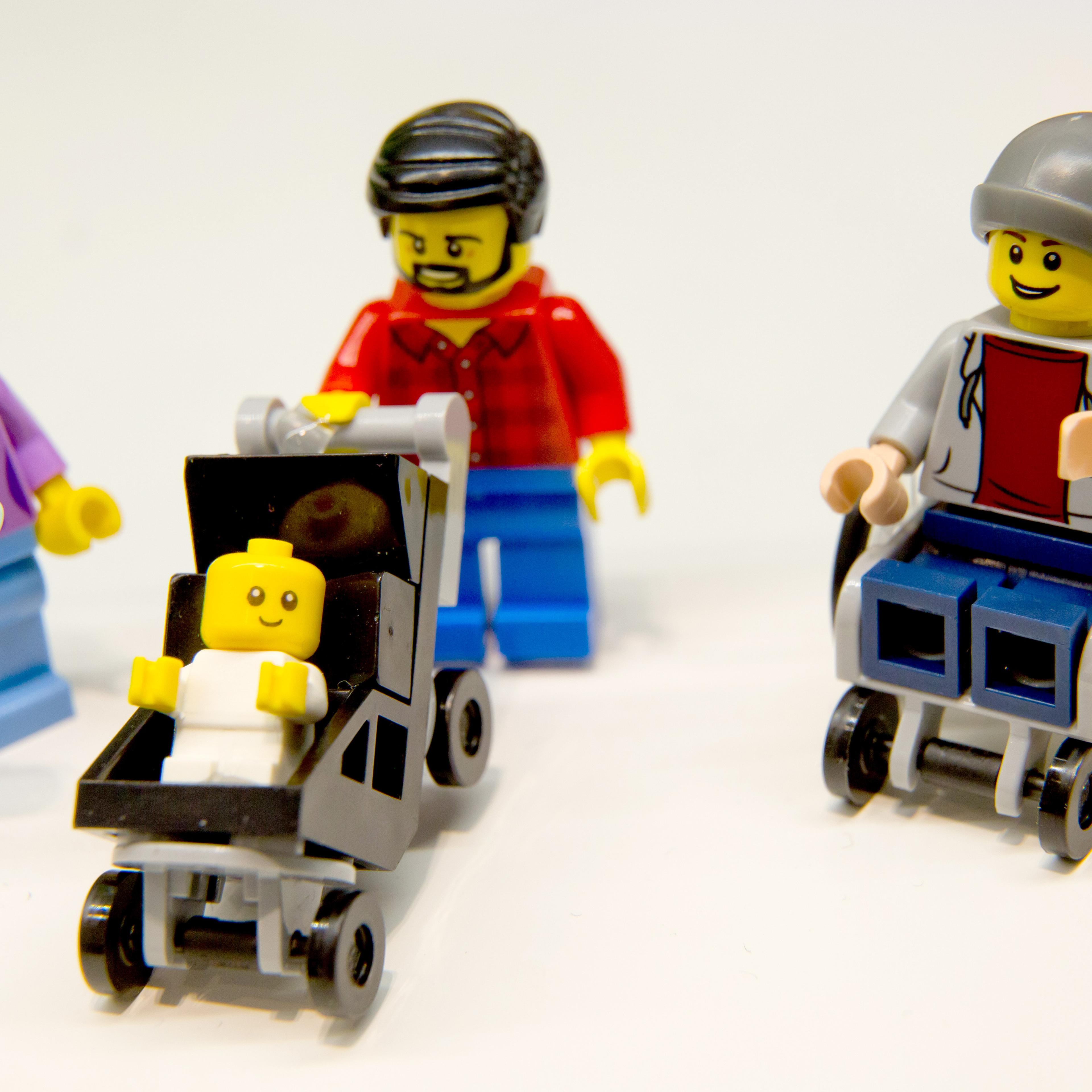 Lego figurines, including one in a wheelchair are pictured at the Lego booth on January 28, 2016 in Nuernberg during the 67th International Toy Fair.