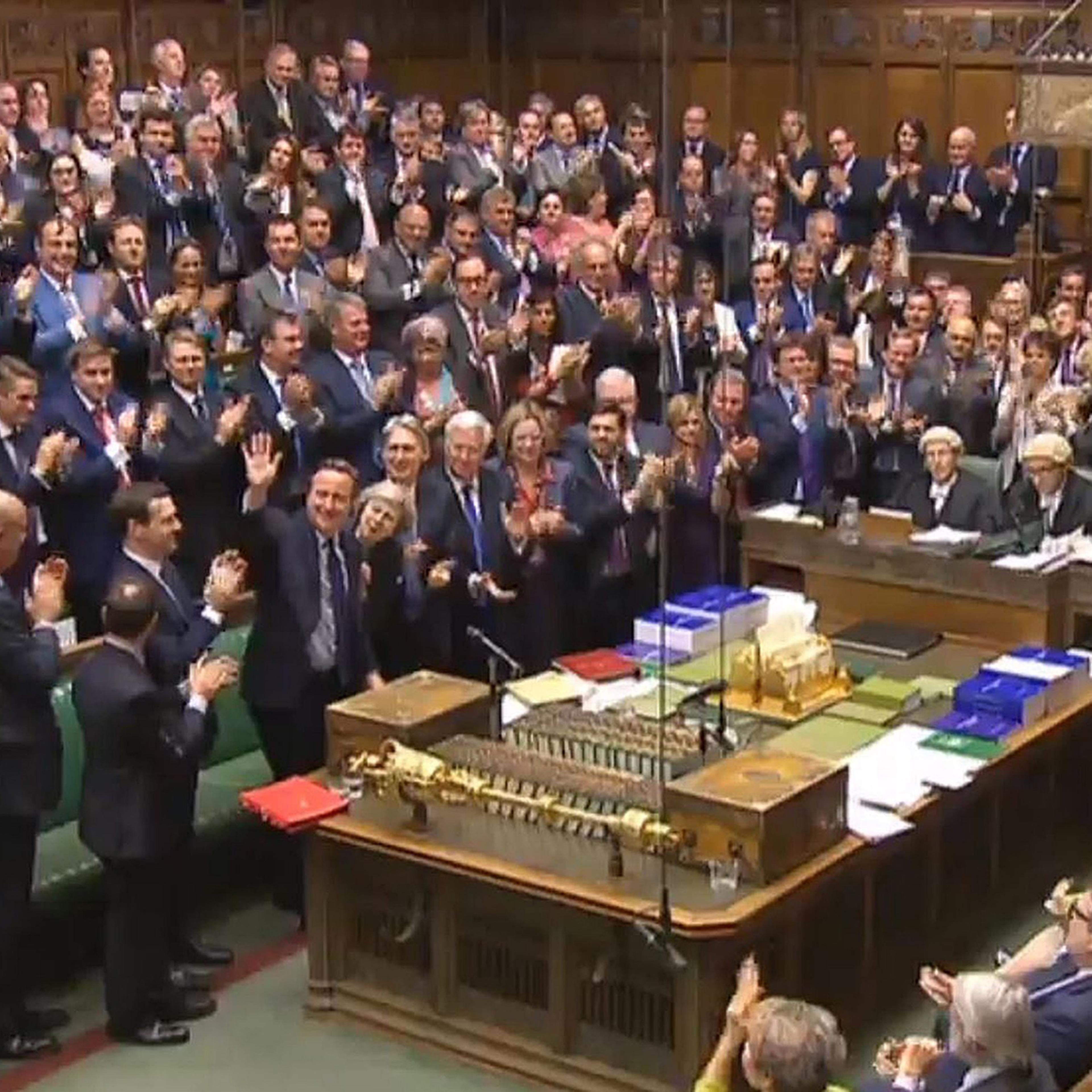 A British Parliament handout photo released shows Conservative Members of Parliament giving outgoing Prime Minister David Cameron a standing ovation after finishing his last Prime Minister's Questions in the House of Commons, in London on July 13, 2016.