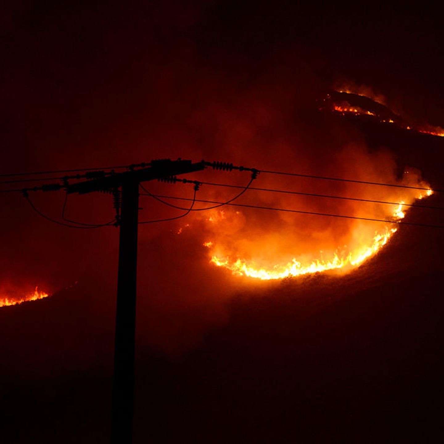 A wildfire burns near power lines in Galicia, Spain in 2022.