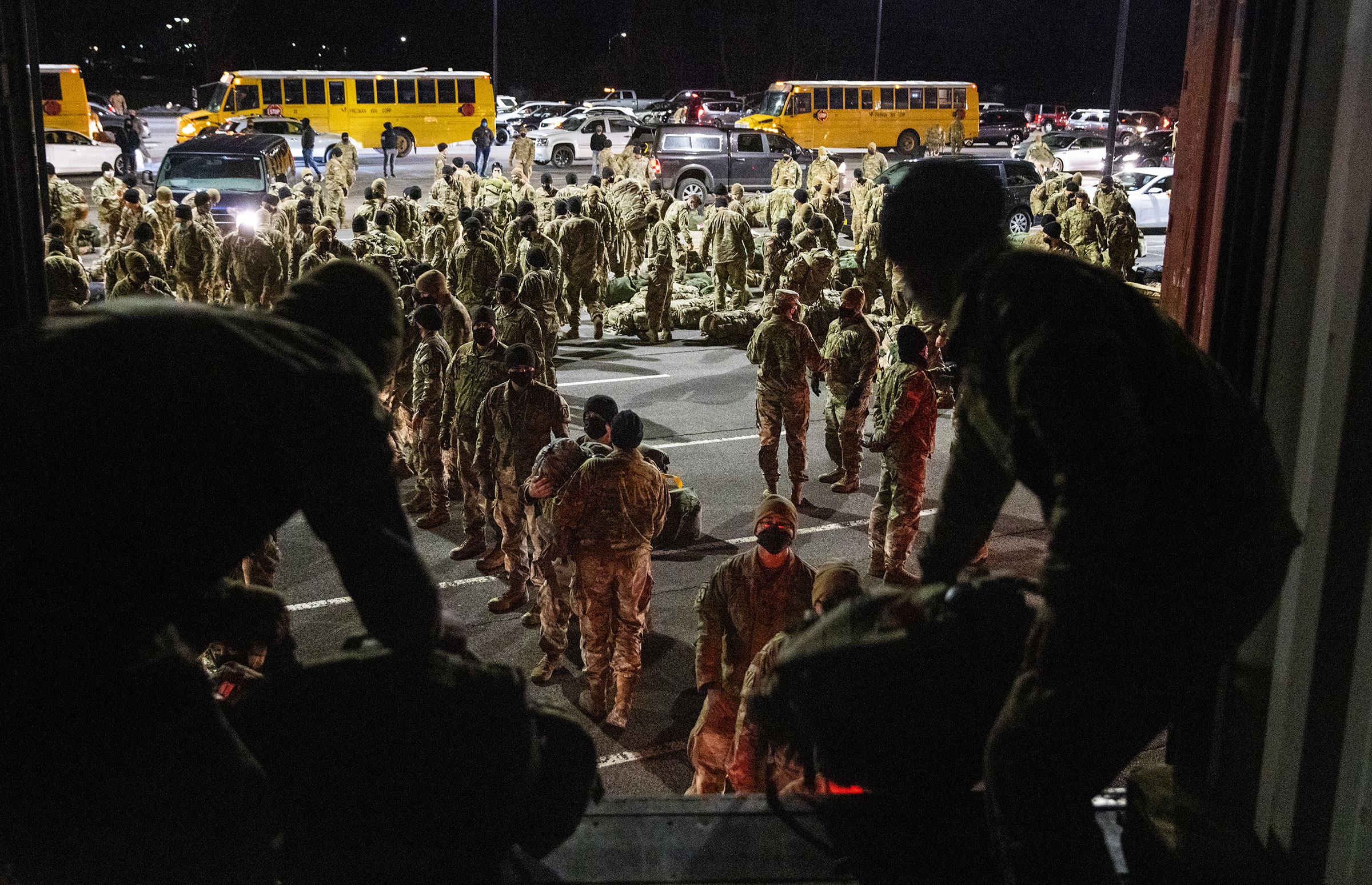 Army troops from the 10th Mountain Division collect their duffels after returning from a 9-month deployment in Afghanistan on Dec. 08, 2020 in Fort Drum, New York.