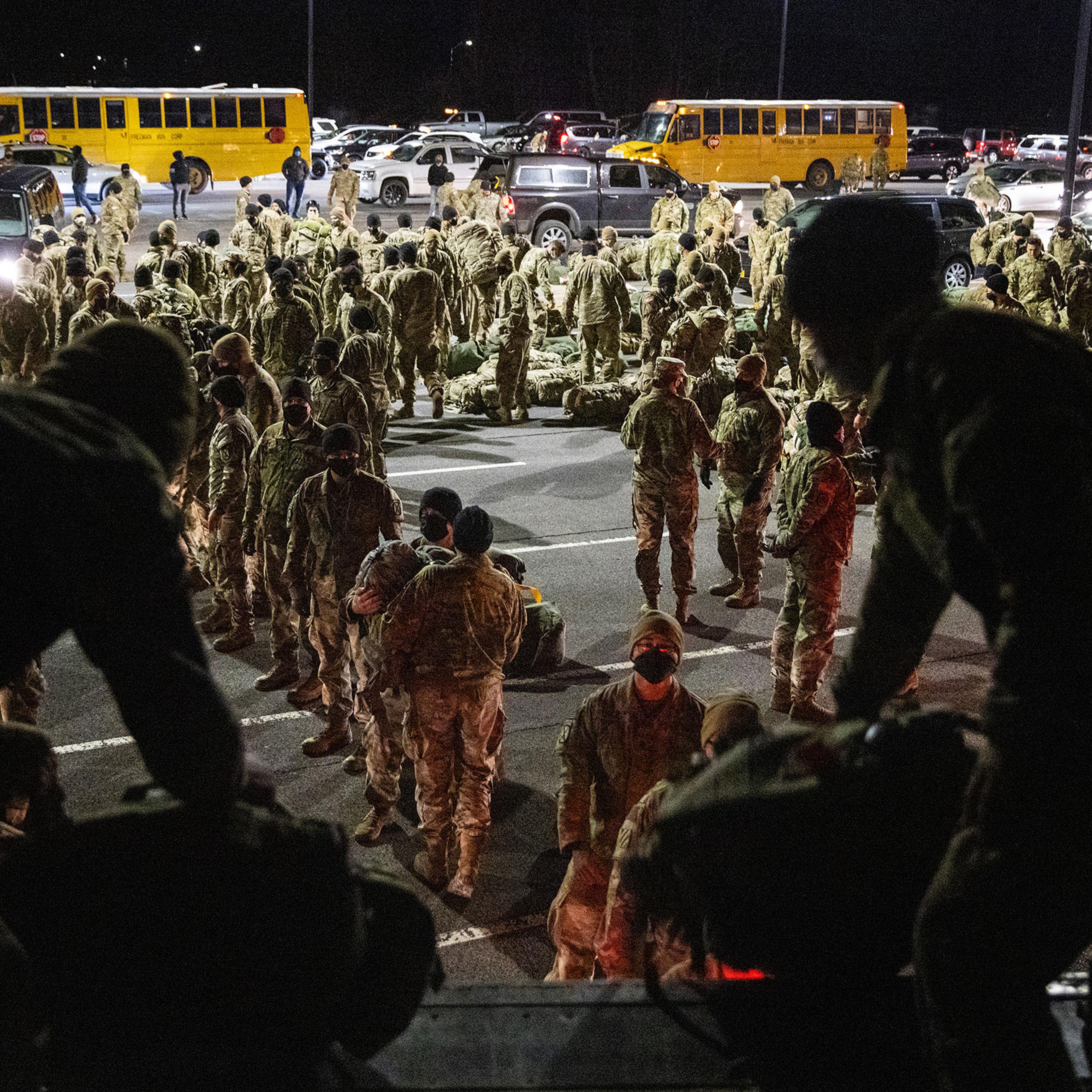Army troops from the 10th Mountain Division collect their duffels after returning from a 9-month deployment in Afghanistan on Dec. 08, 2020 in Fort Drum, New York.