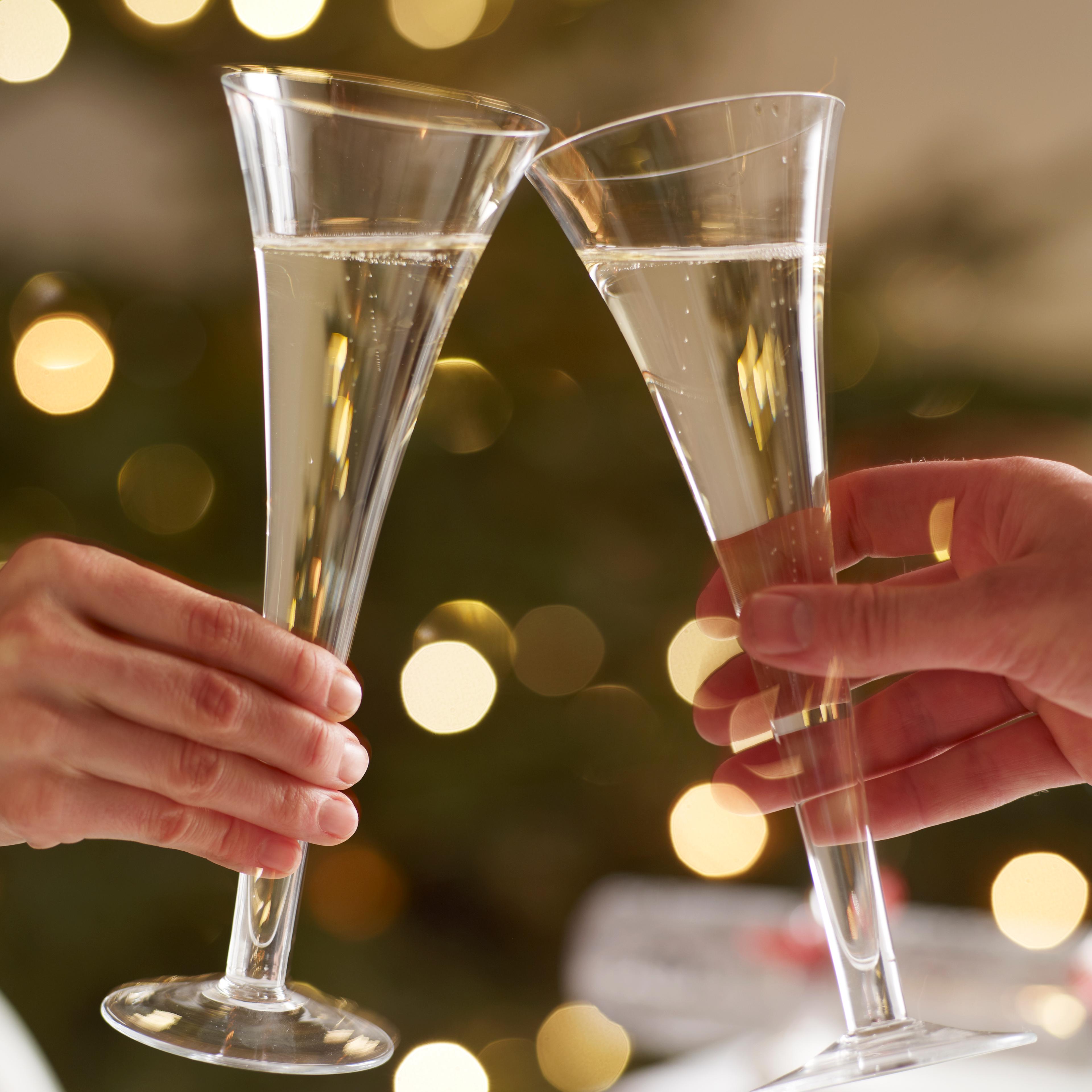 couple toasting with champaigne glasses