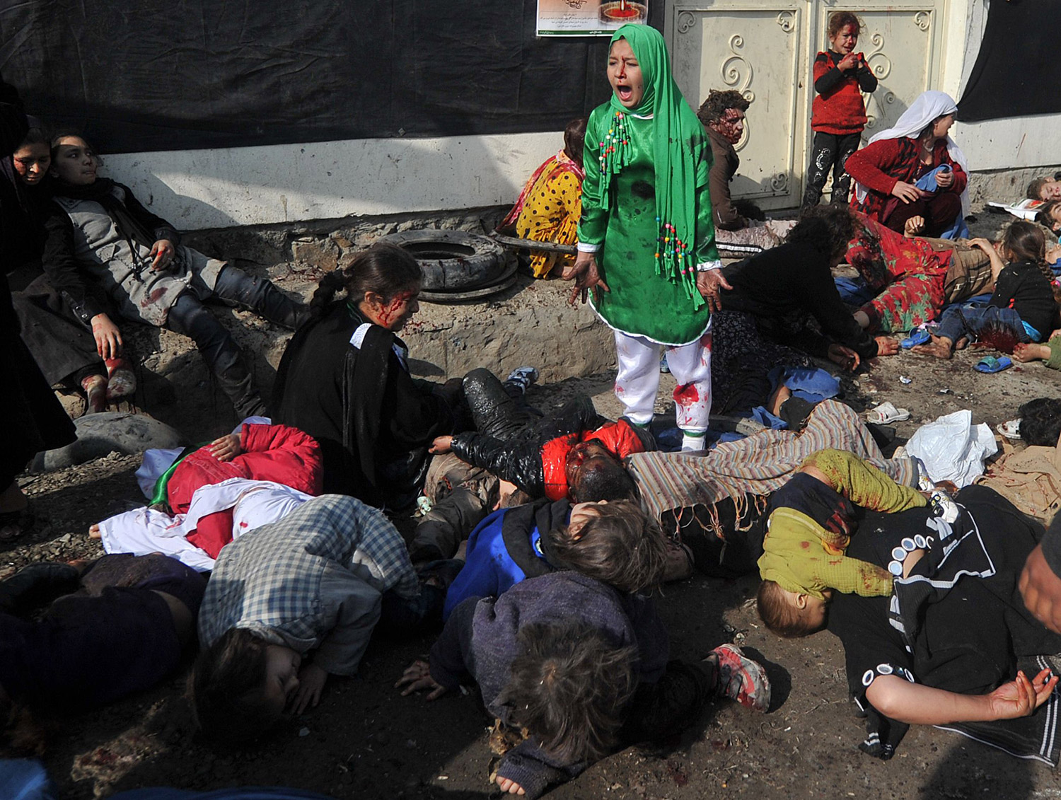 Tarana Akbari, 12, screams after a suicide bombing at Abul Fazel Shrine in Kabul on Dec. 6, 2011