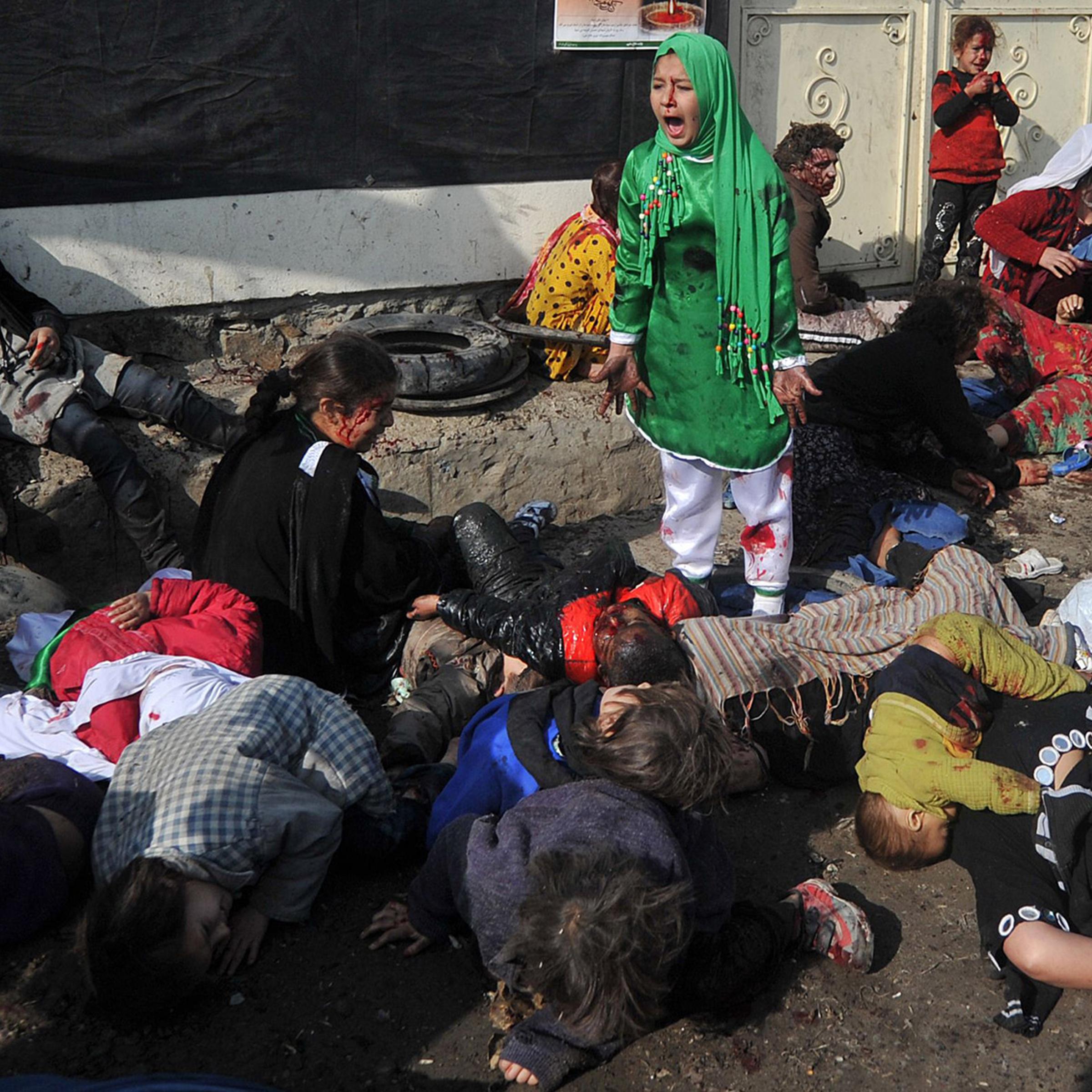 Tarana Akbari, 12, screams after a suicide bombing at Abul Fazel Shrine in Kabul on Dec. 6, 2011
