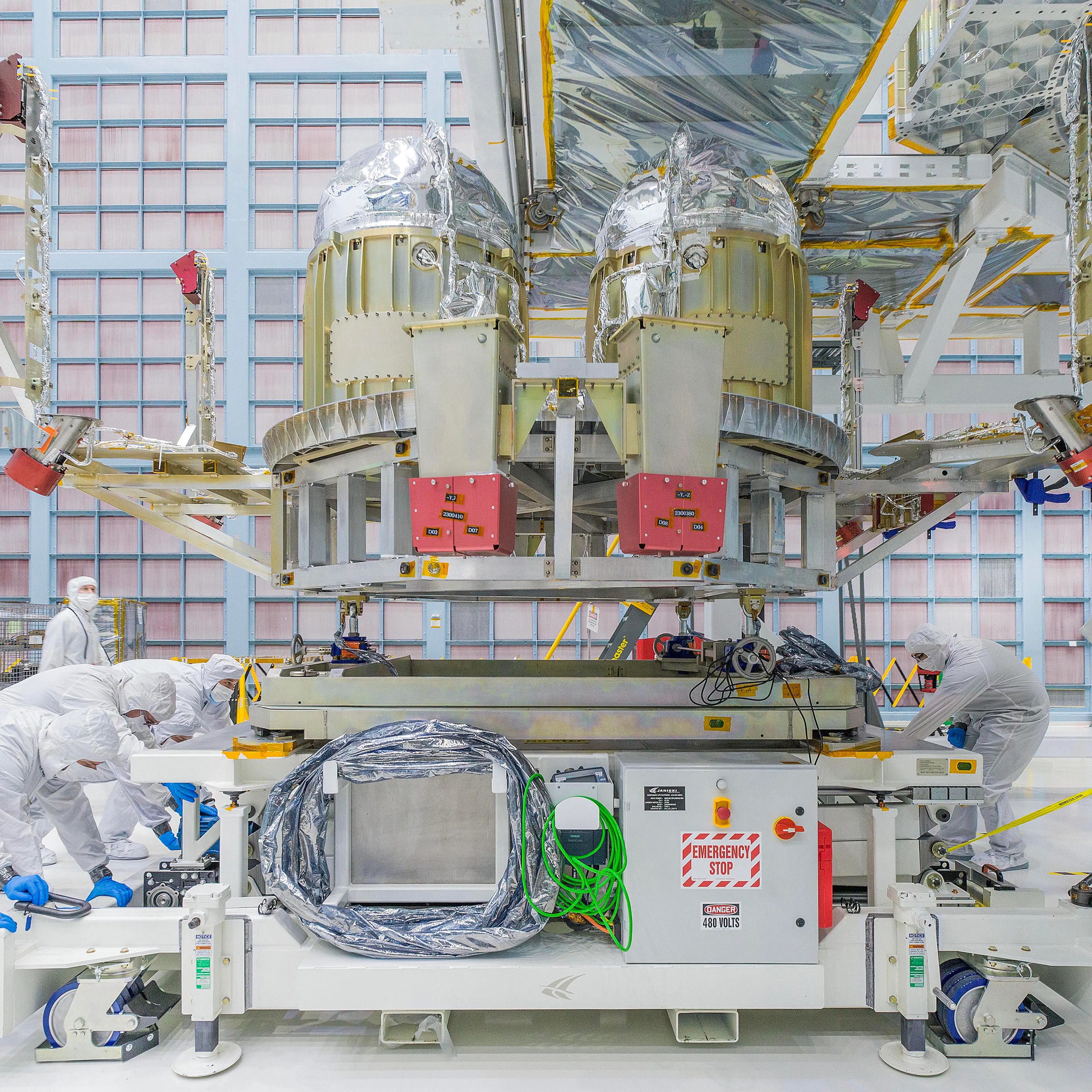 nside the Space Systems Design and Integration Facility (SSDIF), NASA Goddard Space Flight Center's giant cleanroom. The Roman Space Telescope's propulsion system is is pushed into position under the spacecraft bus in preparation for integration.