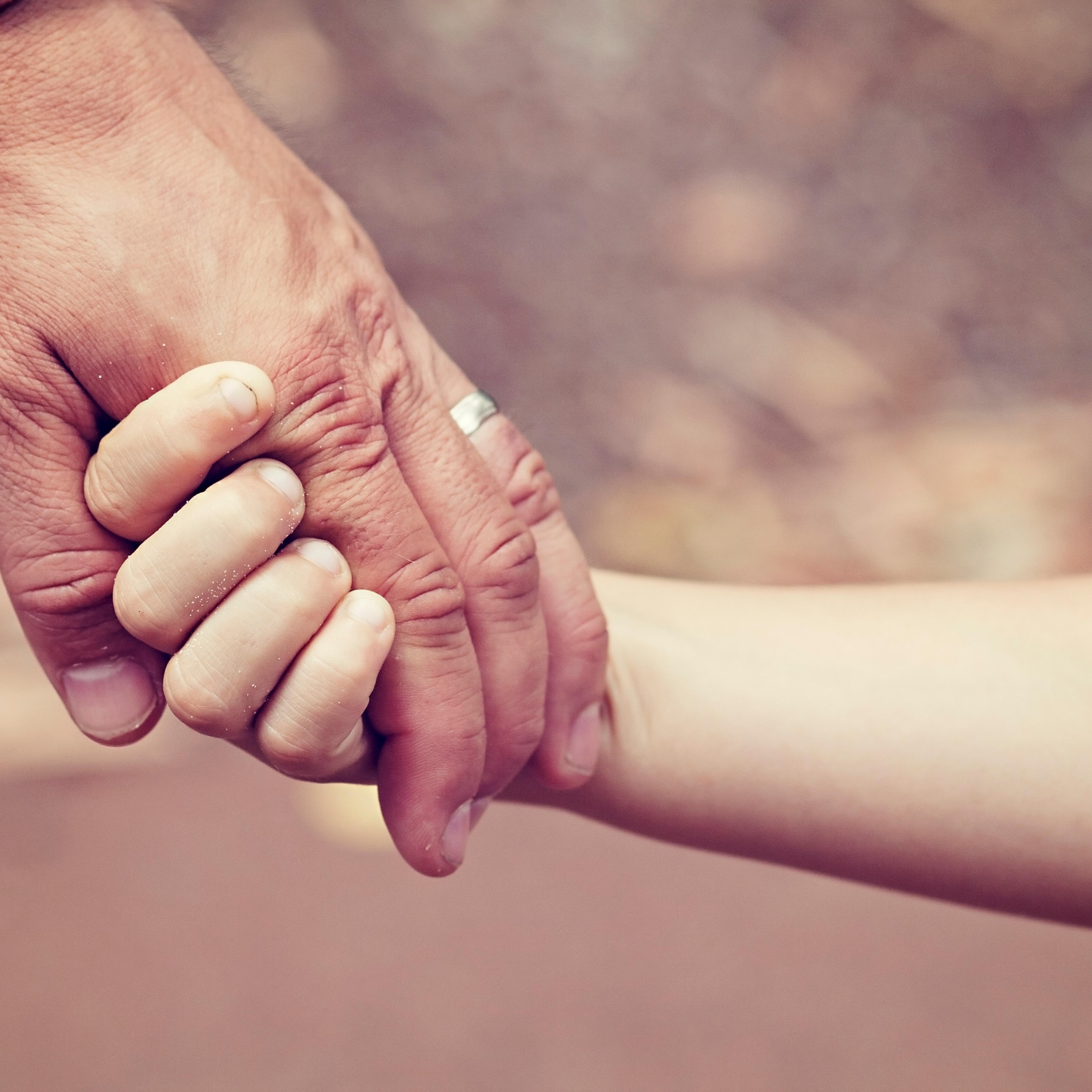Father and daughters hands