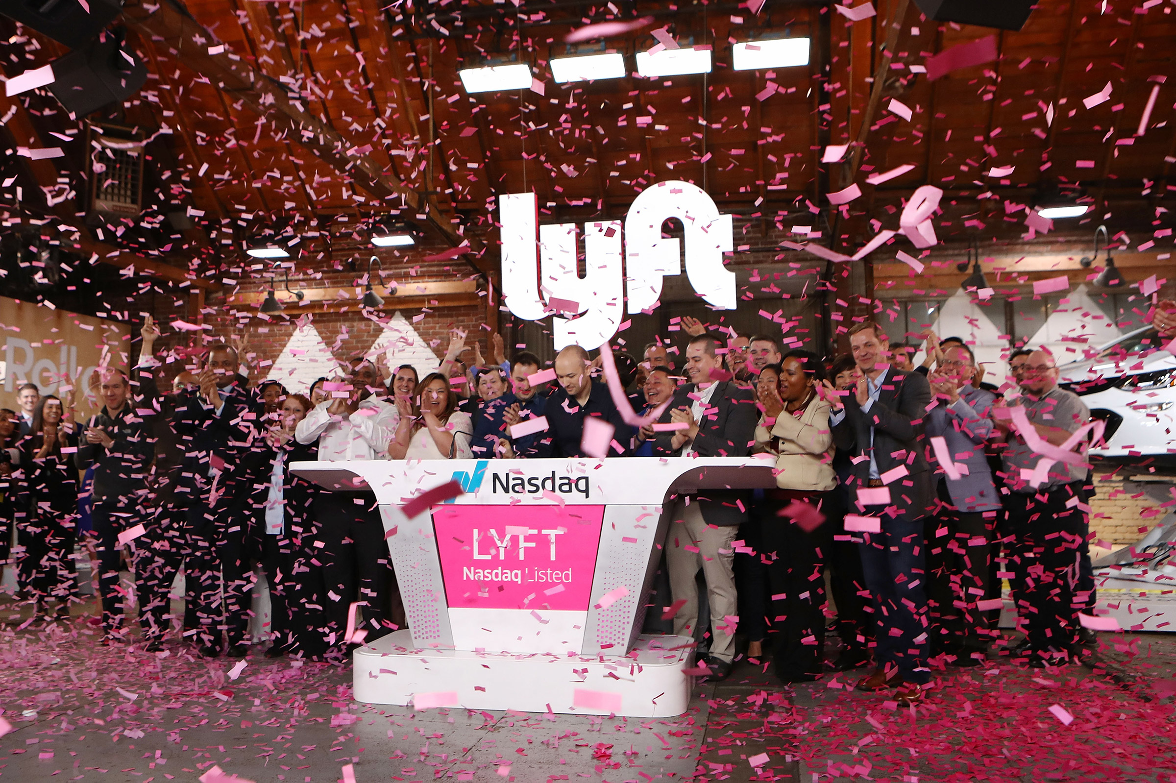 Confetti falls as Lyft CEO Logan Green rings the Nasdaq opening bell celebrating the company's initial public offering on March 29, 2019 in Los Angeles.