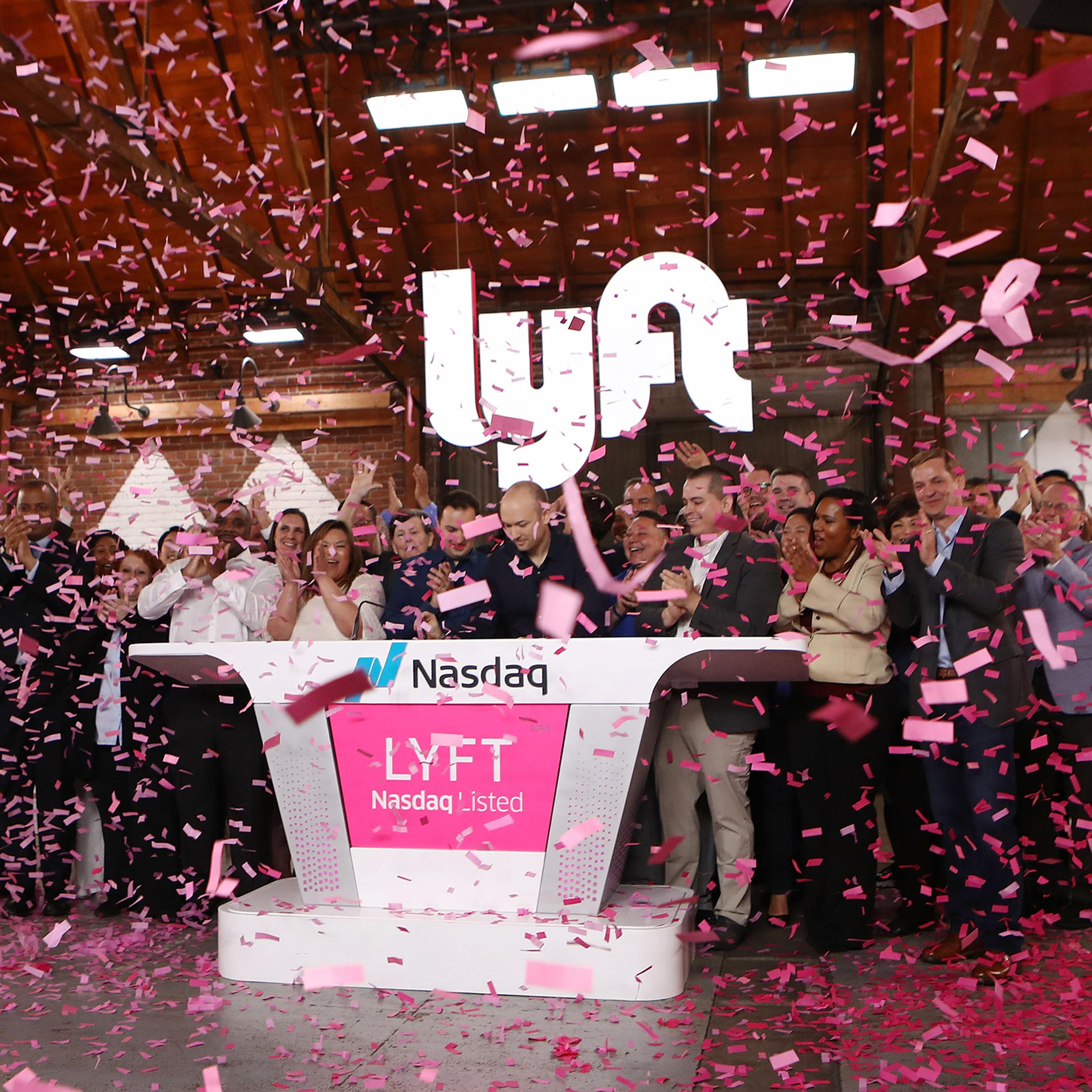 Confetti falls as Lyft CEO Logan Green rings the Nasdaq opening bell celebrating the company's initial public offering on March 29, 2019 in Los Angeles.