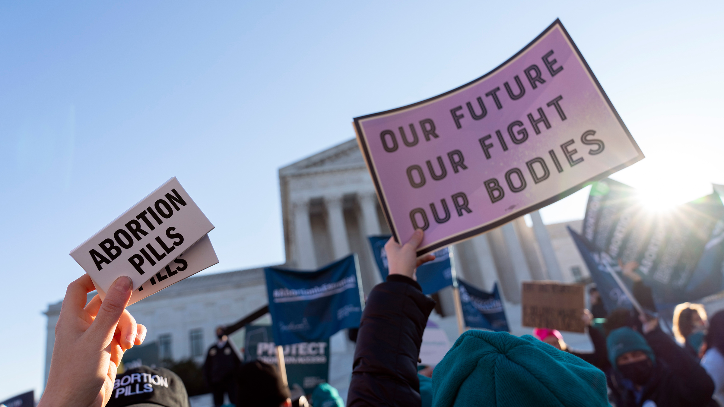 Abortion rights advocates showing a pack of abortion pills demonstrate in front of the U.S. Supreme Court Wednesday, Dec. 1, 2021, in Washington, DC.