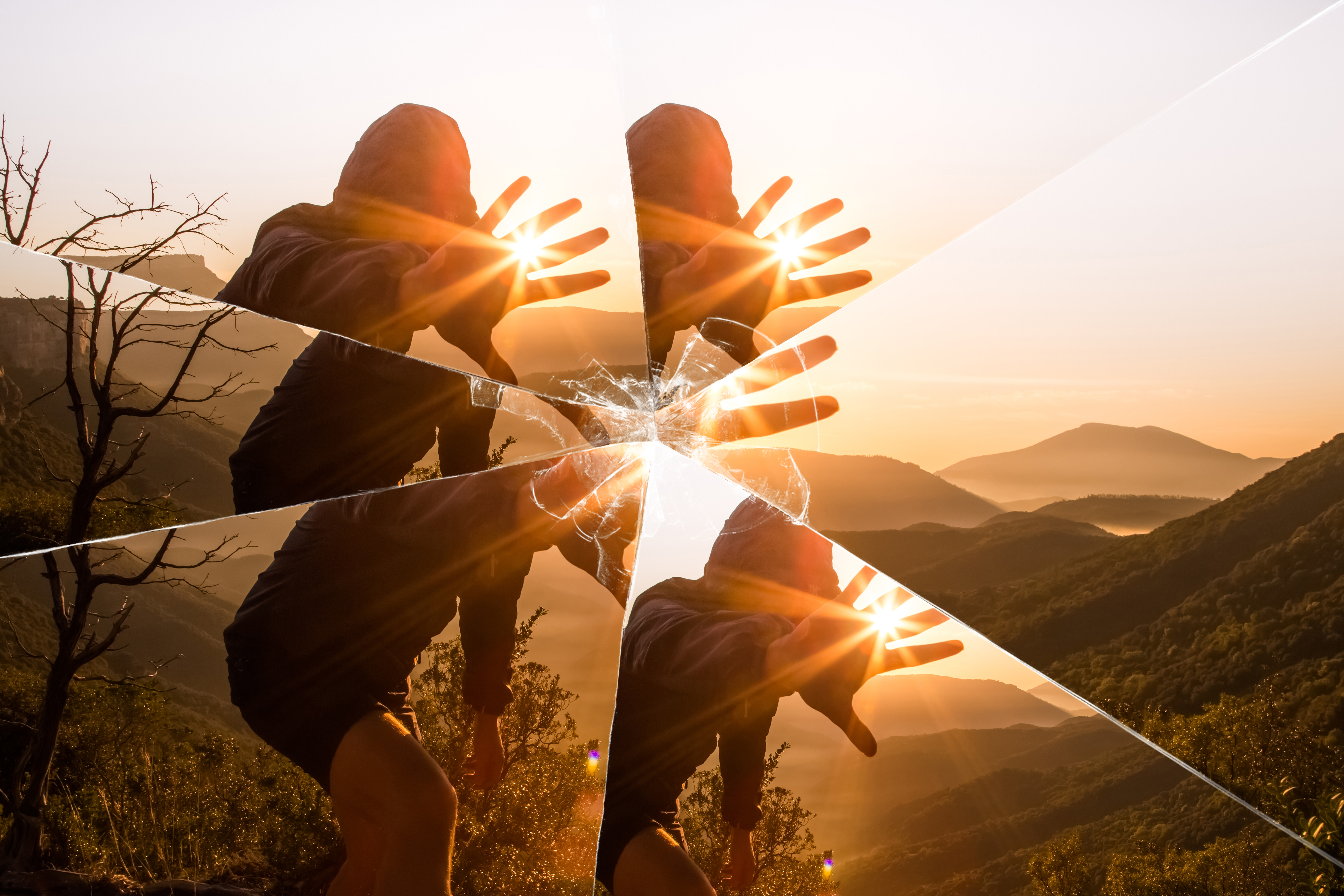 INJY-Mirror-Mystic picture of guy playing with sunlight during sunrise in the nature seen through a broken mirror.