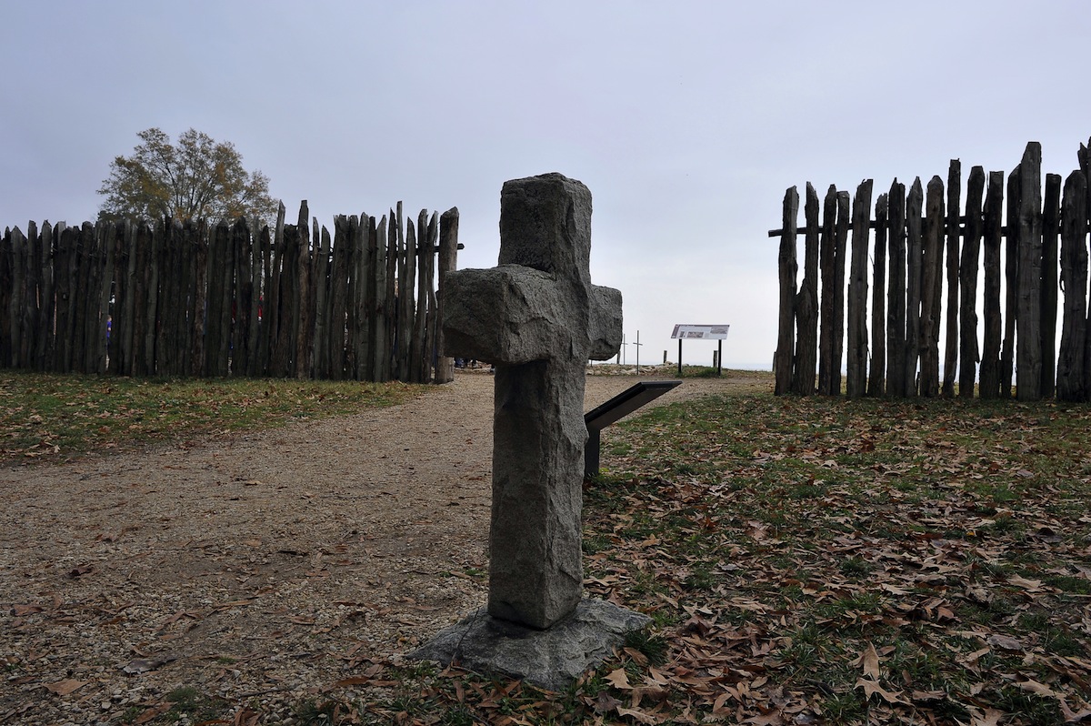 A stone cross marking the grave of a 17t