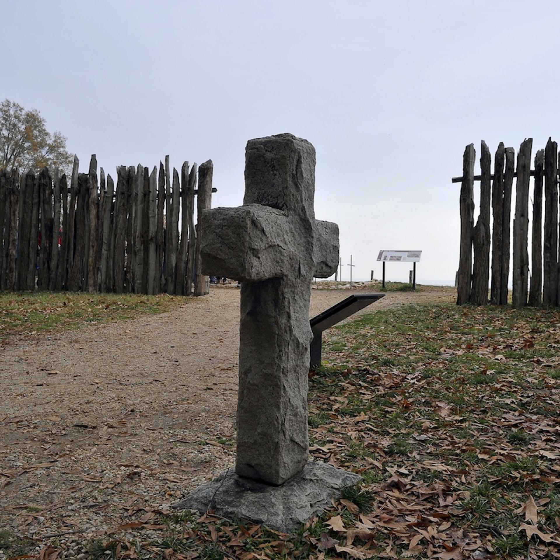 A stone cross marking the grave of a 17t