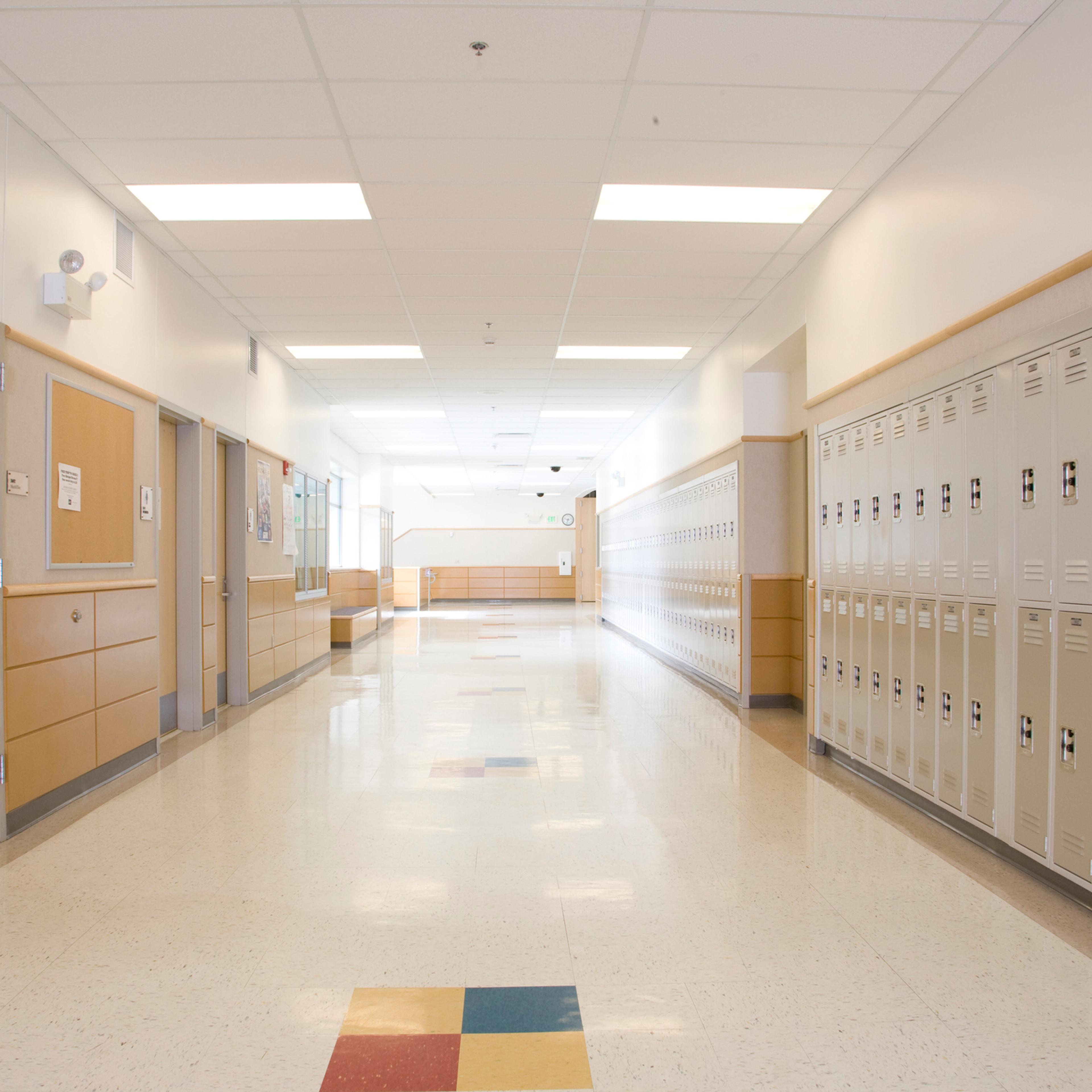 Lockers in empty high school corridor