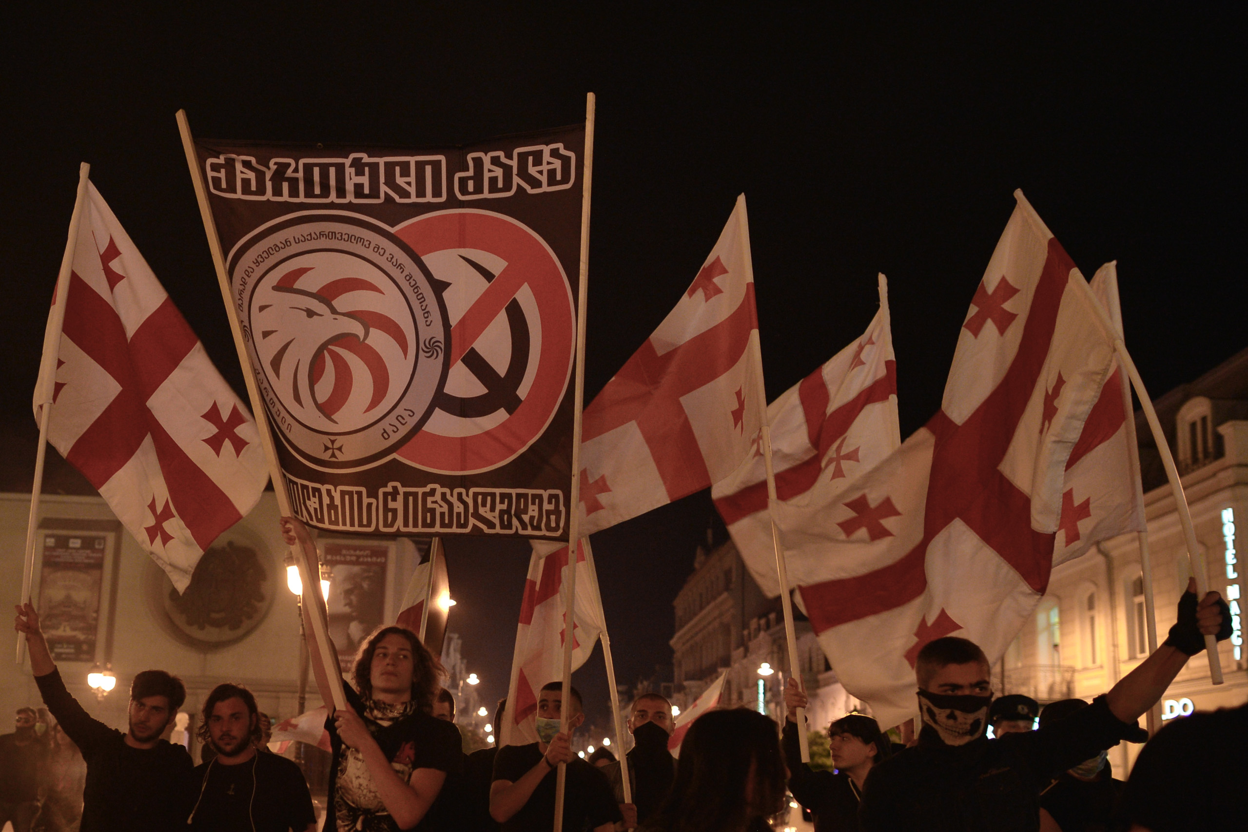 TBILISI, GEORGIA - MAY 26, 2016 - A goup of young Nationalists walk throught Tbilisi center on the day that the country celebrates its Independence Day commemorating the adoption of the Act of Independence in 1918, that outlined the main principles of th