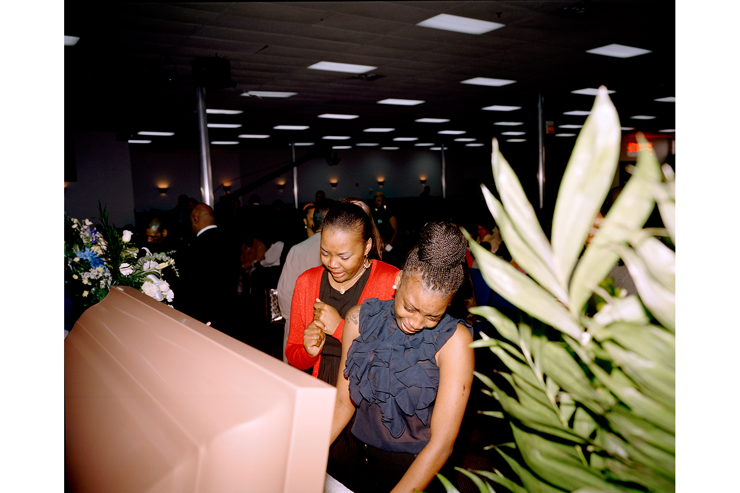 Friends of Deshaun Williams attend his funeral at the Monument of Faith Church in Chicago. Williams was killed in a shooting outside an Englewood nightclub the evening of February 22, 2013 at the age of 25. He was a graduate of the University of Houston, where he played basketball.