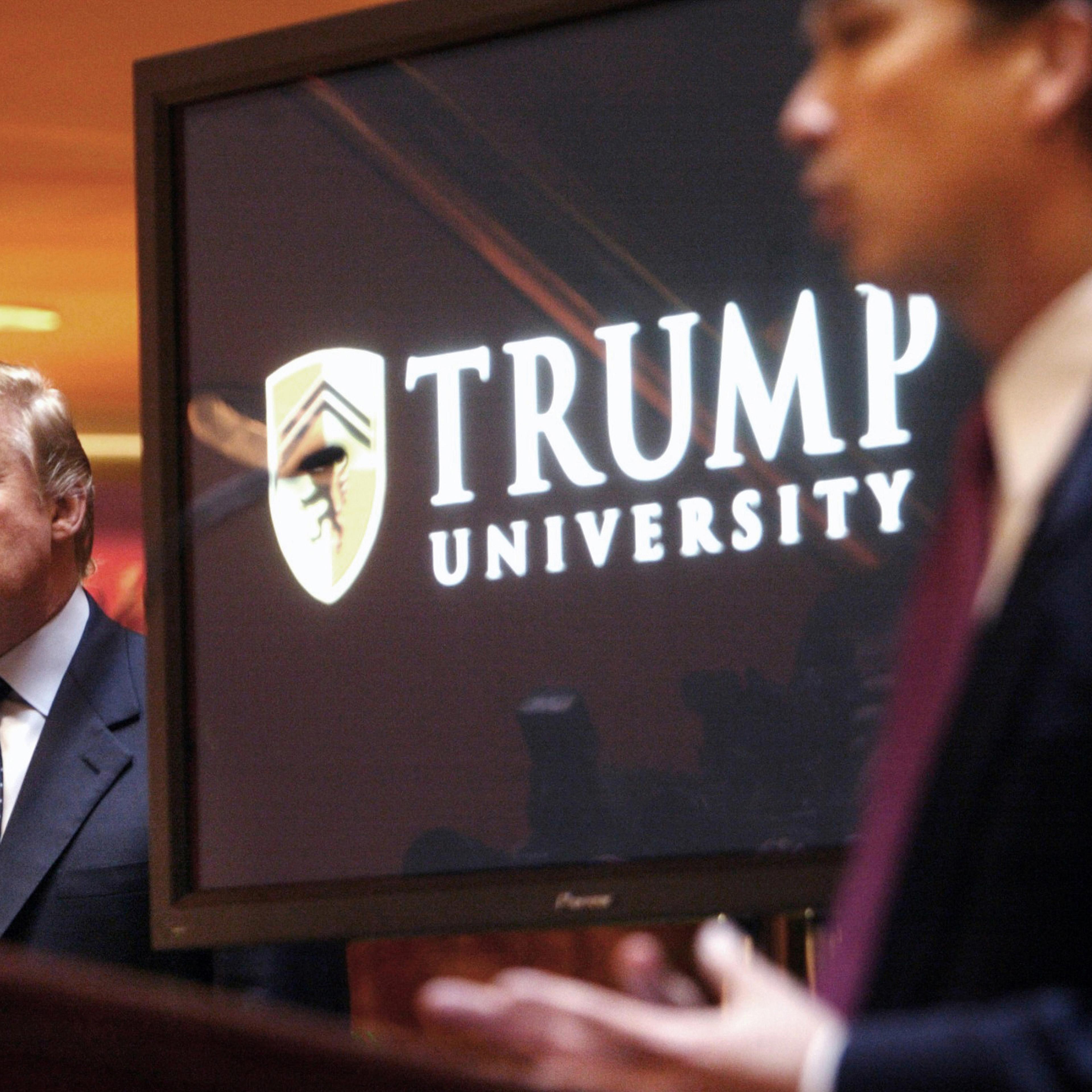 FILE- In this May 23, 2005, file photo, real estate mogul and Reality TV star Donald Trump, left, listens as Michael Sexton introduces him at a news conference in New York where he announced the establishment of Trump University. Tarla Makaeff a yoga ins