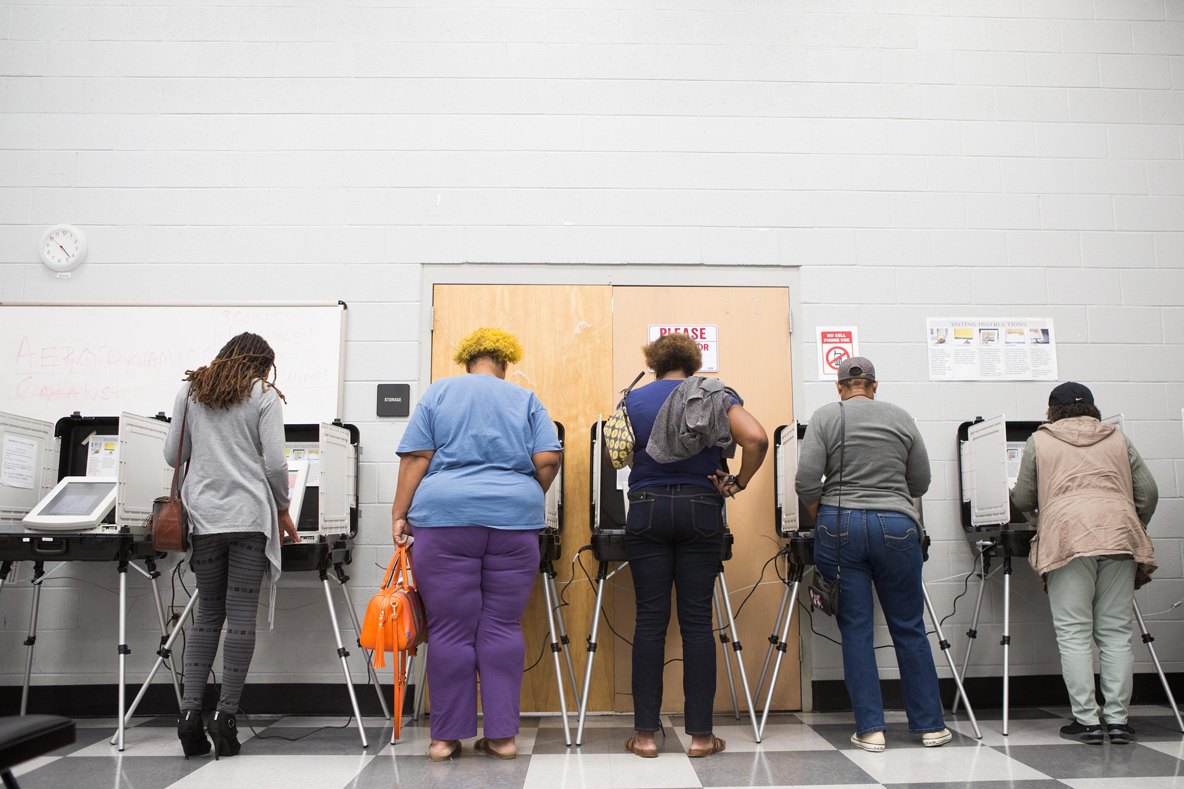 Voters cast their ballots during early voting in Atlanta on Oct. 18