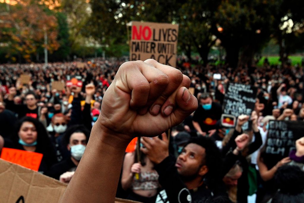 TOPSHOT-AUSTRALIA-US-POLITICS-RACE-UNREST