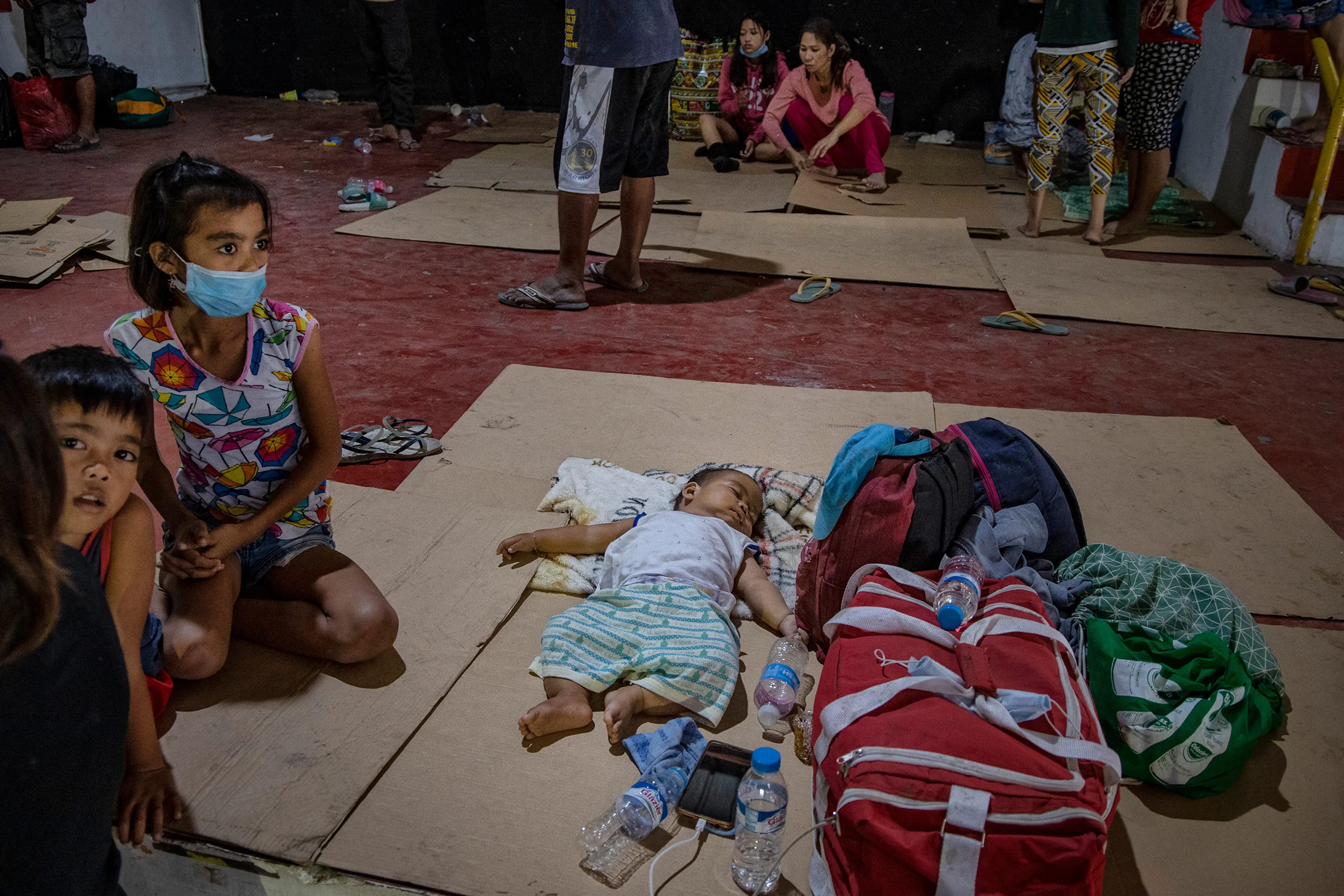 Residents who fled Taal's eruption at an evacuation center in Santo Thomas on Jan. 13.
