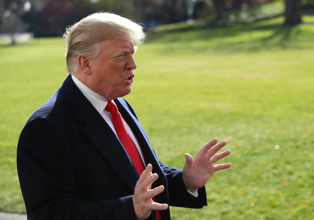 President Donald Trump speaks with the media