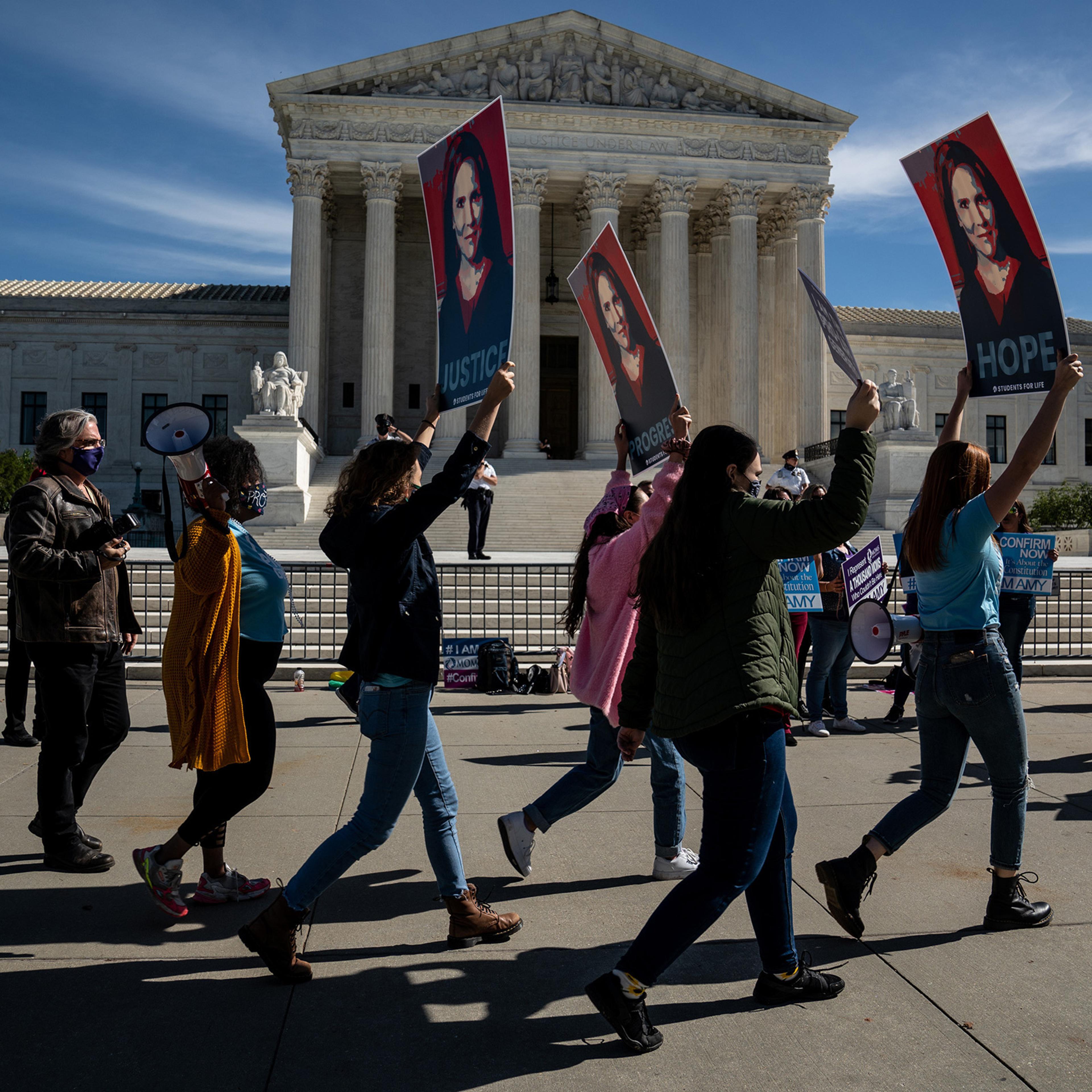 Supporters of Judge Amy Coney Barrett stand outside the Supreme Court in Washington, D.C., on Oct. 14.