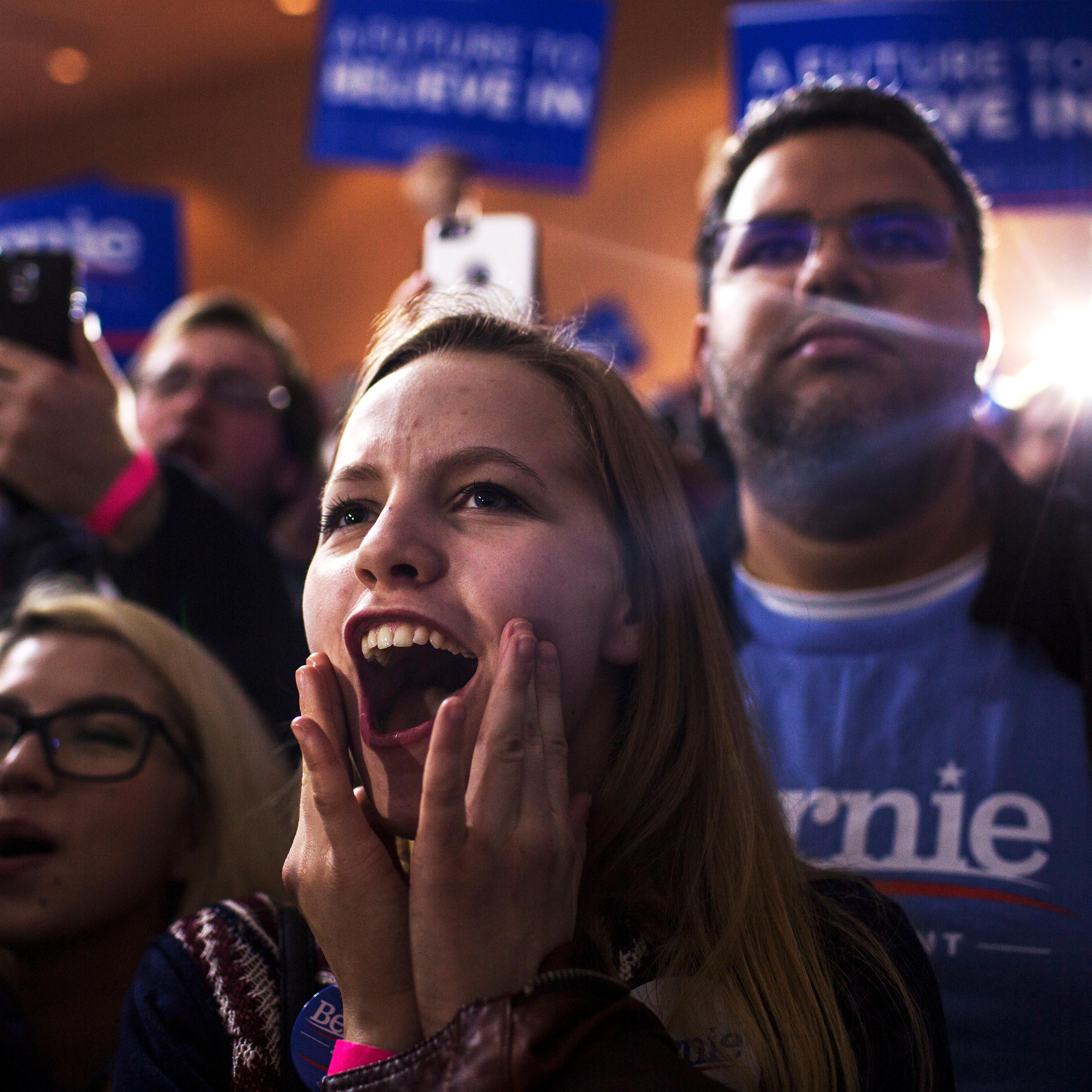 Supporters react during a caucus night party for Democratic presidential candidate, Vermont Sen. Bernie Sanders in Des Moines, Iowa on Feb. 1, 2016.