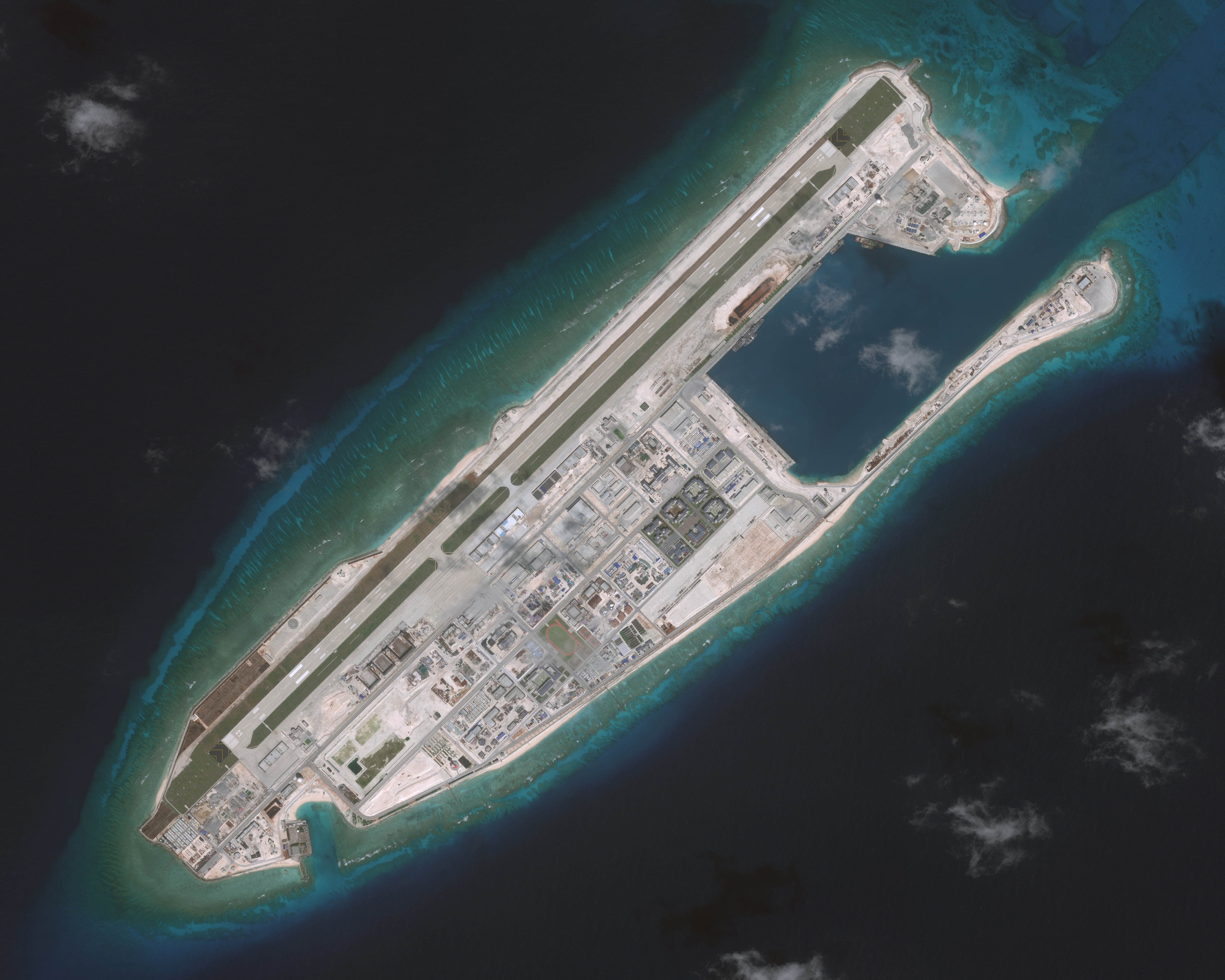 NOV 10, 2016: DigitalGlobe imagery (overview) of the Fiery Cross Reef located in the South China Sea. Fiery Cross is located in the western part of the Spratly Islands group.