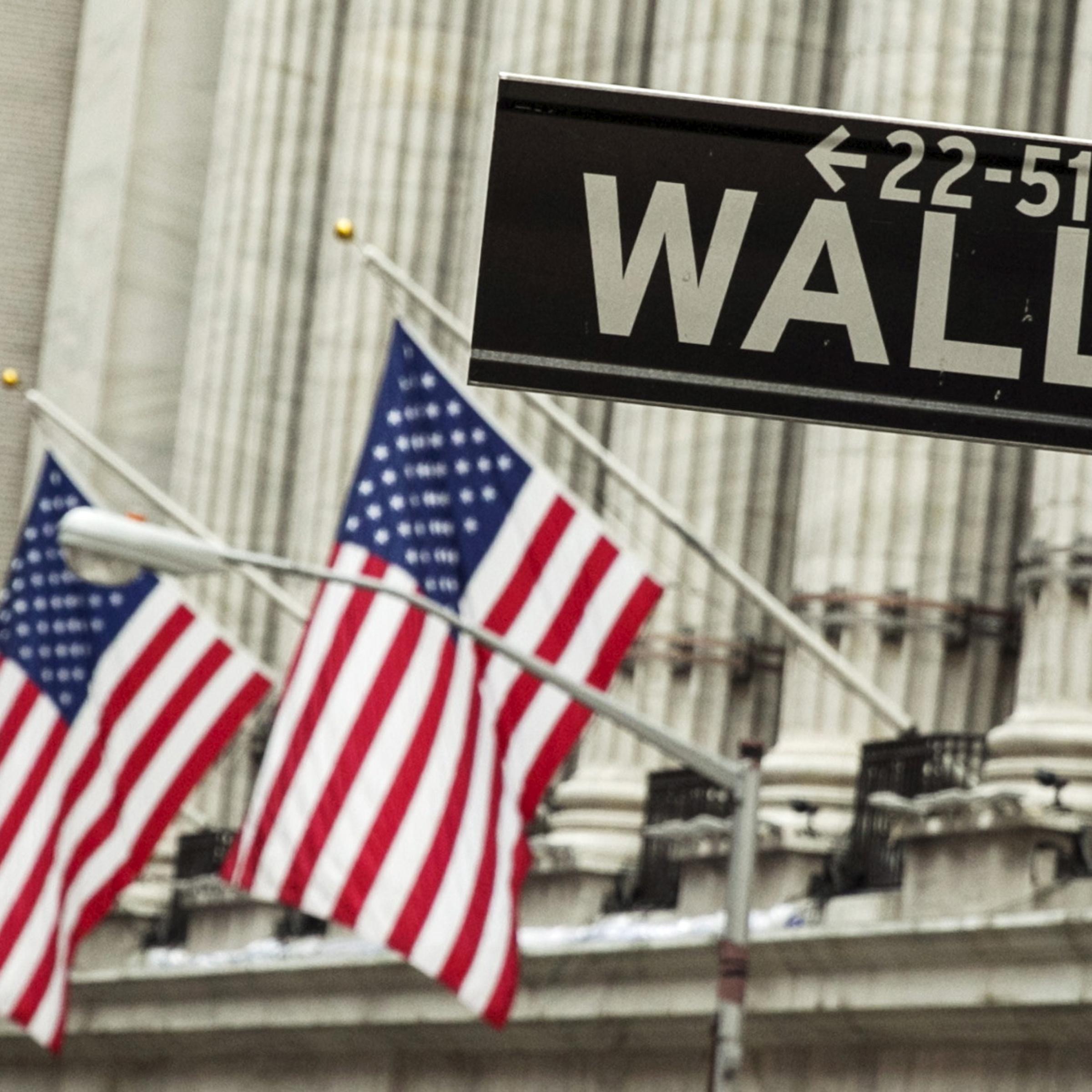 A sign hangs in front of U.S. flags outside of the New York Stock Exchange in New York