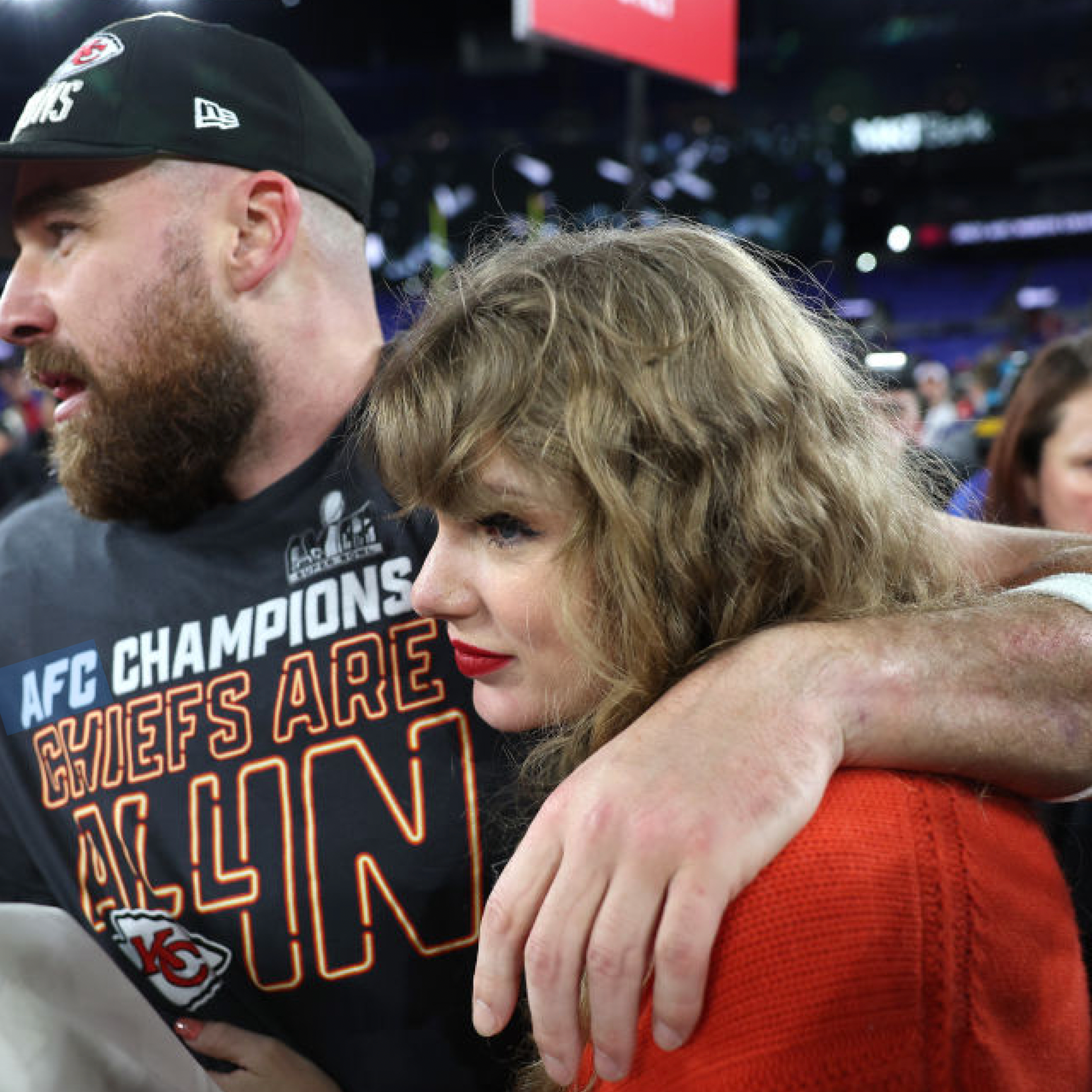 Taylor Swift and Travis Kelce, seen here on the field after an NFL game in Jan. 2024, have each donated $100,000 to victims of the Kansas City Chiefs Super Bowl parade shooting.