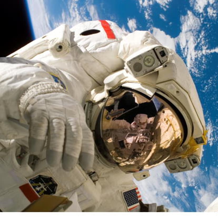 Space Shuttle Astronauts Work Aboard Space Station
