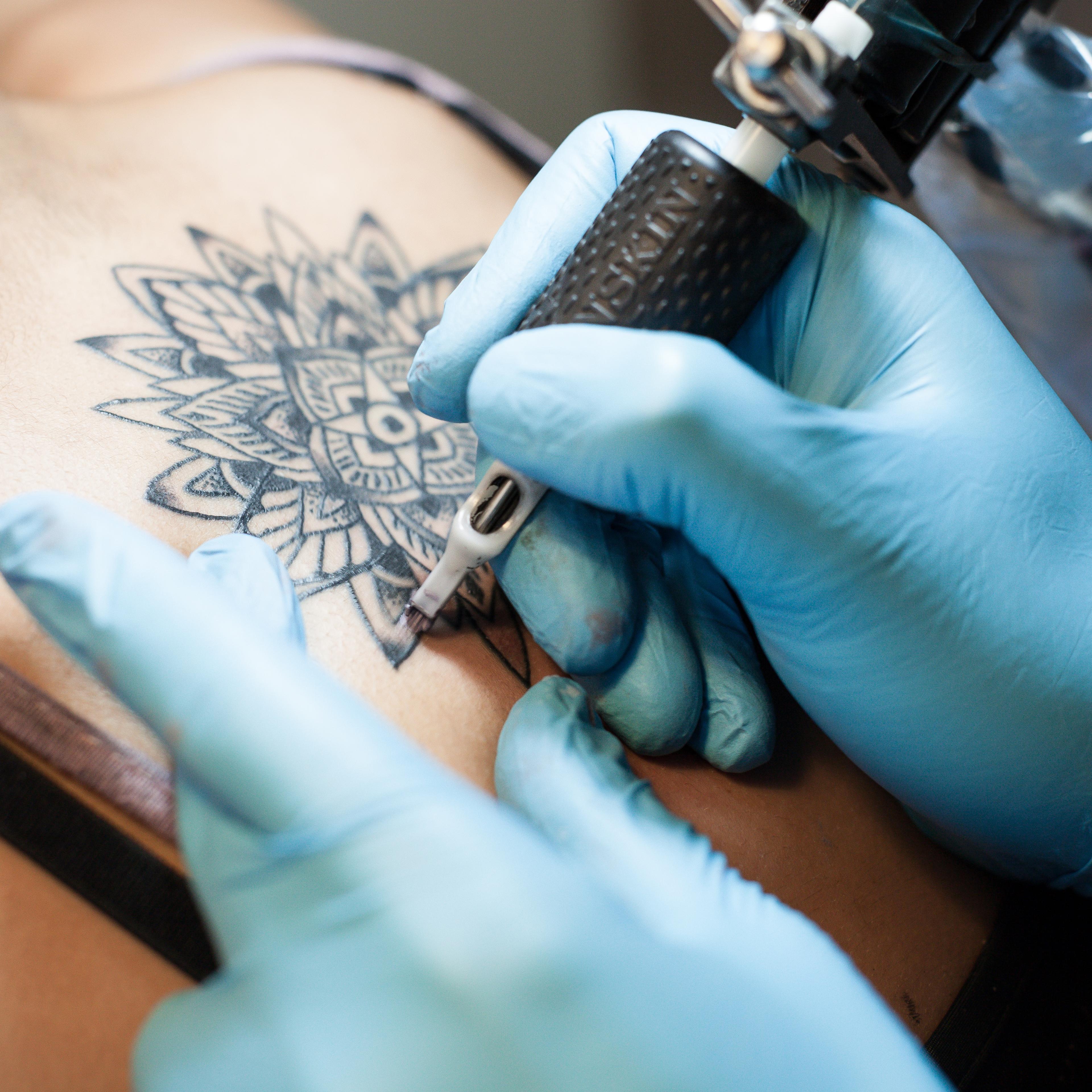 Tattoo artist at work