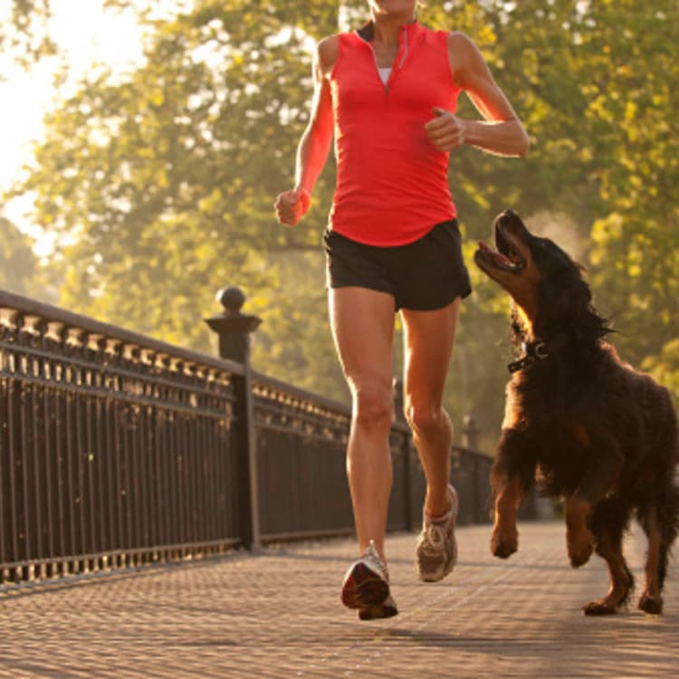 woman-running-with-dog
