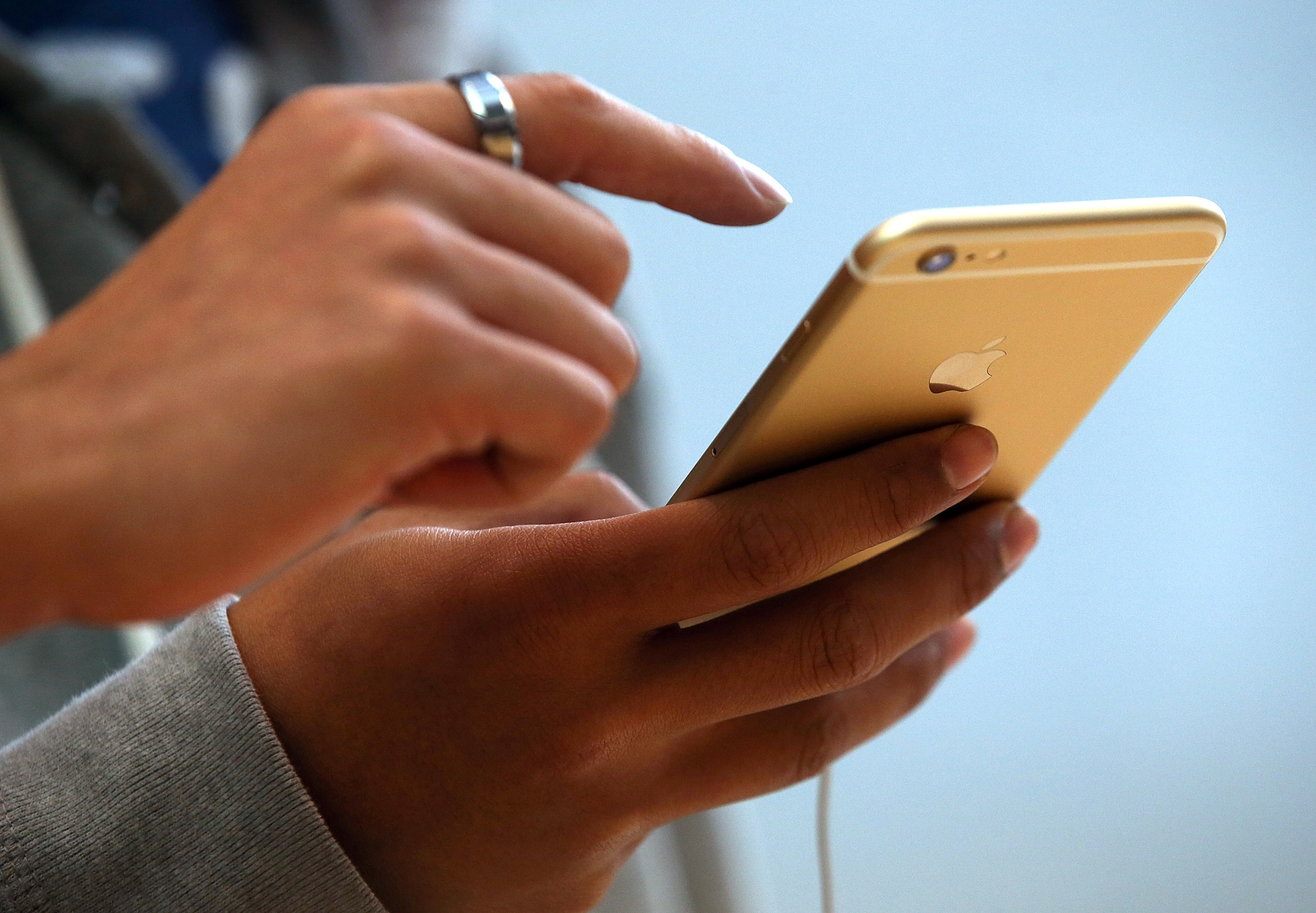 Customers look at the new iPhone 6 at an Apple Store on Sept. 19, 2014 in Palo Alto, California.
