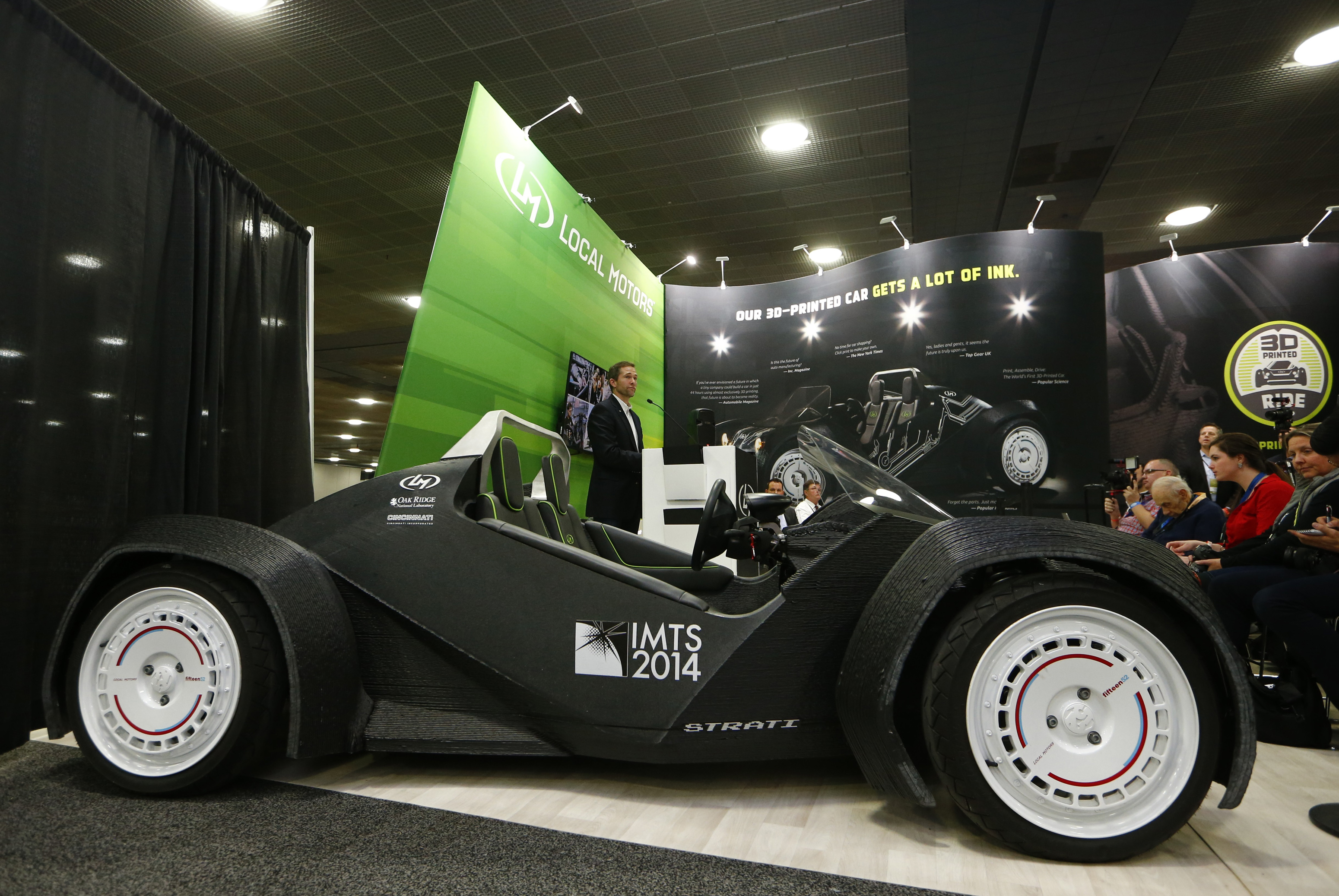 CEO and founder of Local Motors John B. Rogers speaks to the media as his company showcases the world's first 3-D printed car, the Strati, at the Detroit auto show on Jan. 12, 2015.