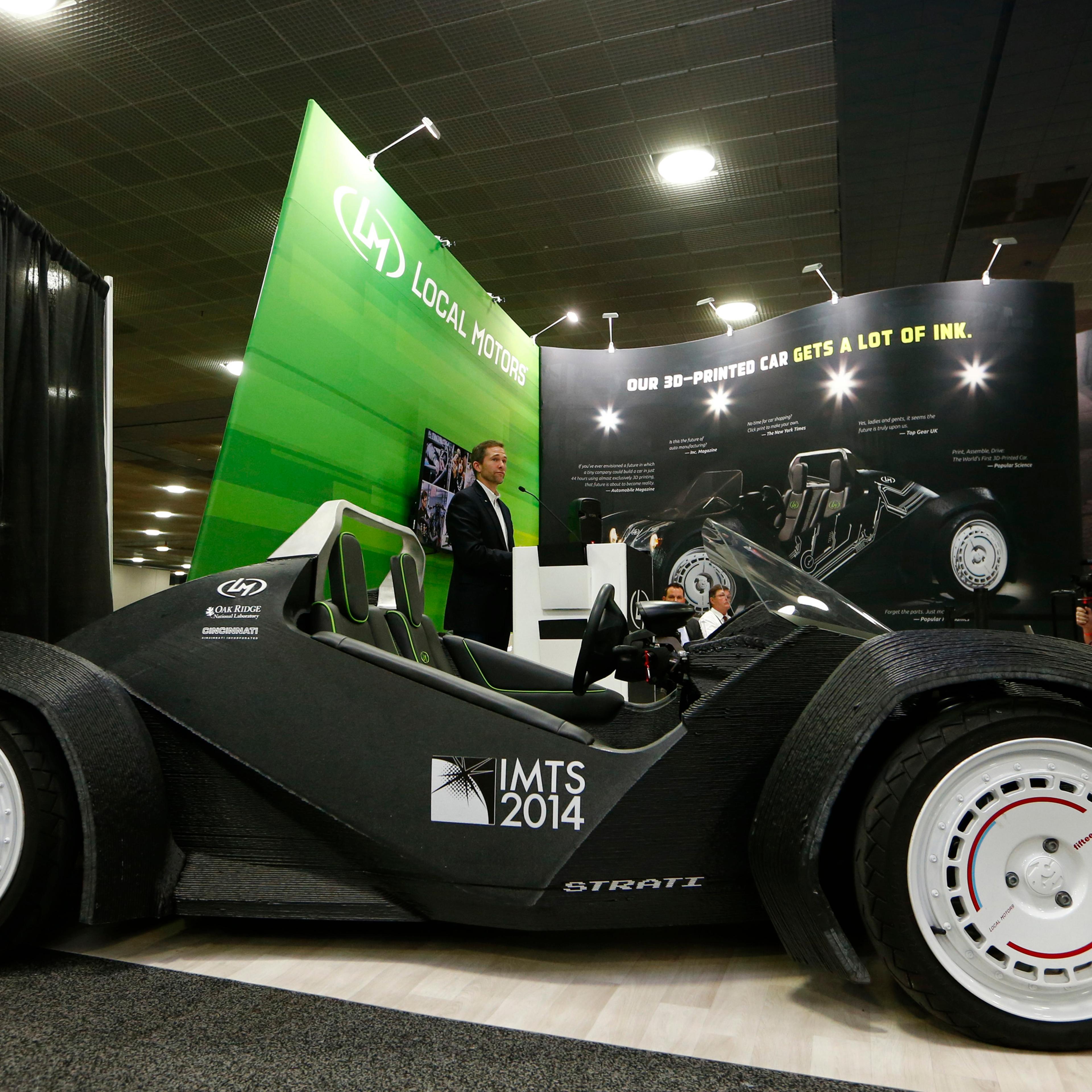 CEO and founder of Local Motors John B. Rogers speaks to the media as his company showcases the world's first 3-D printed car, the Strati, at the Detroit auto show on Jan. 12, 2015.