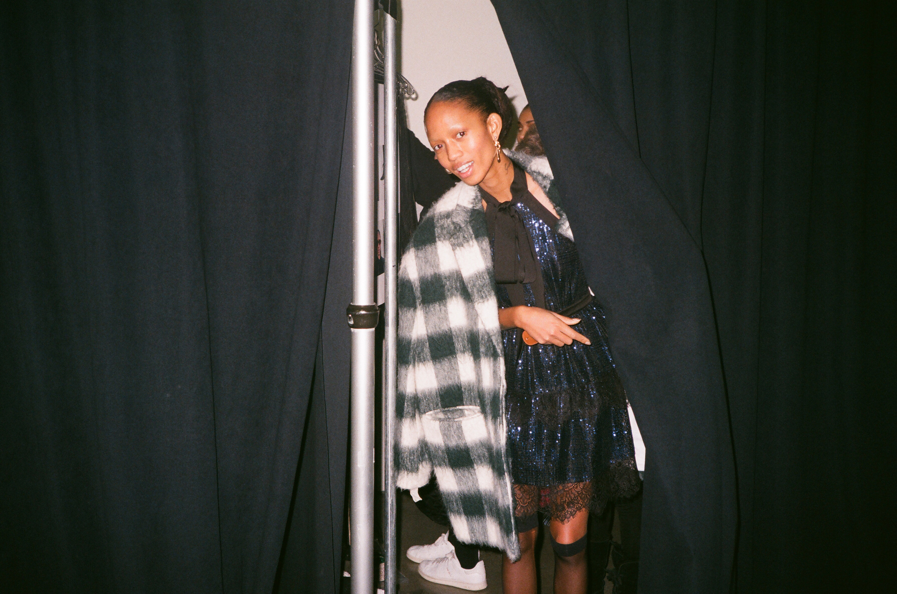 Adesuwa Aighewi comes out of her dressing area in her first look.