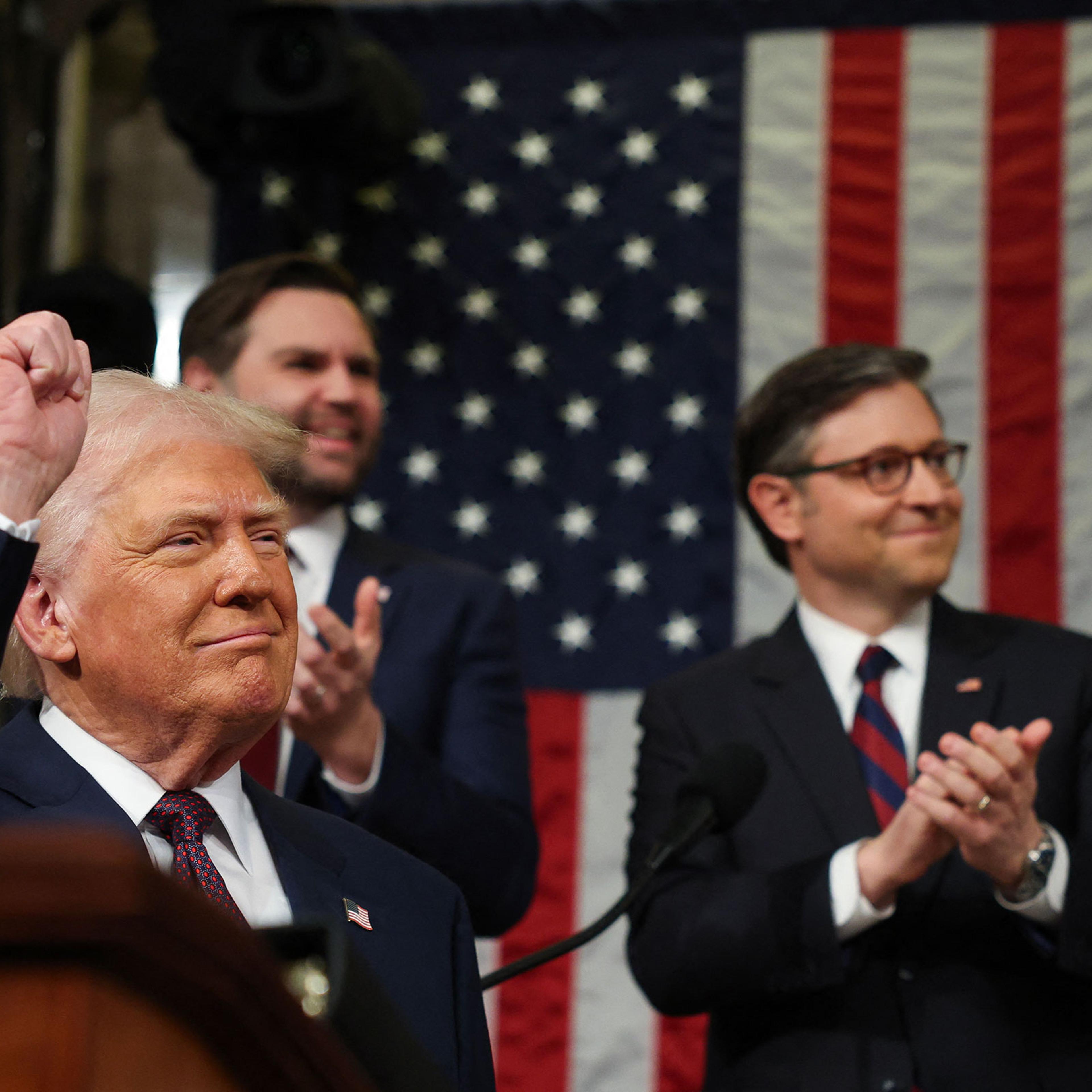 Speaker of the House Mike Johnson and Vice President JD Vance applaud as President Donald Trump arrives to address a joint session of Congress at the US Capitol in Washington, DC, on March 4, 2025.