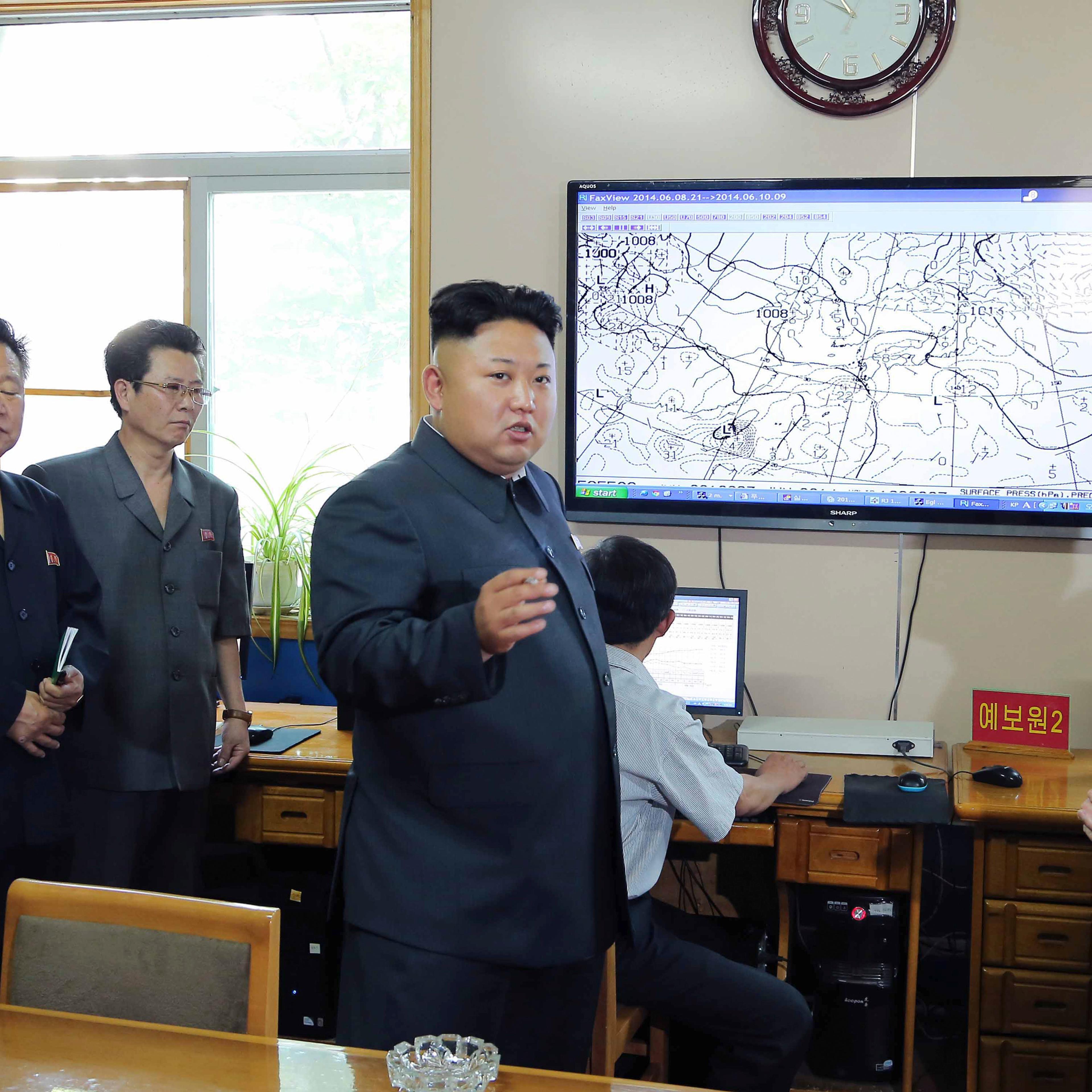 North Korean leader Kim Jong Un gives field guidance to the Hydro-meteorological Service in this undated photo released by North Korea's KCNA in Pyongyang