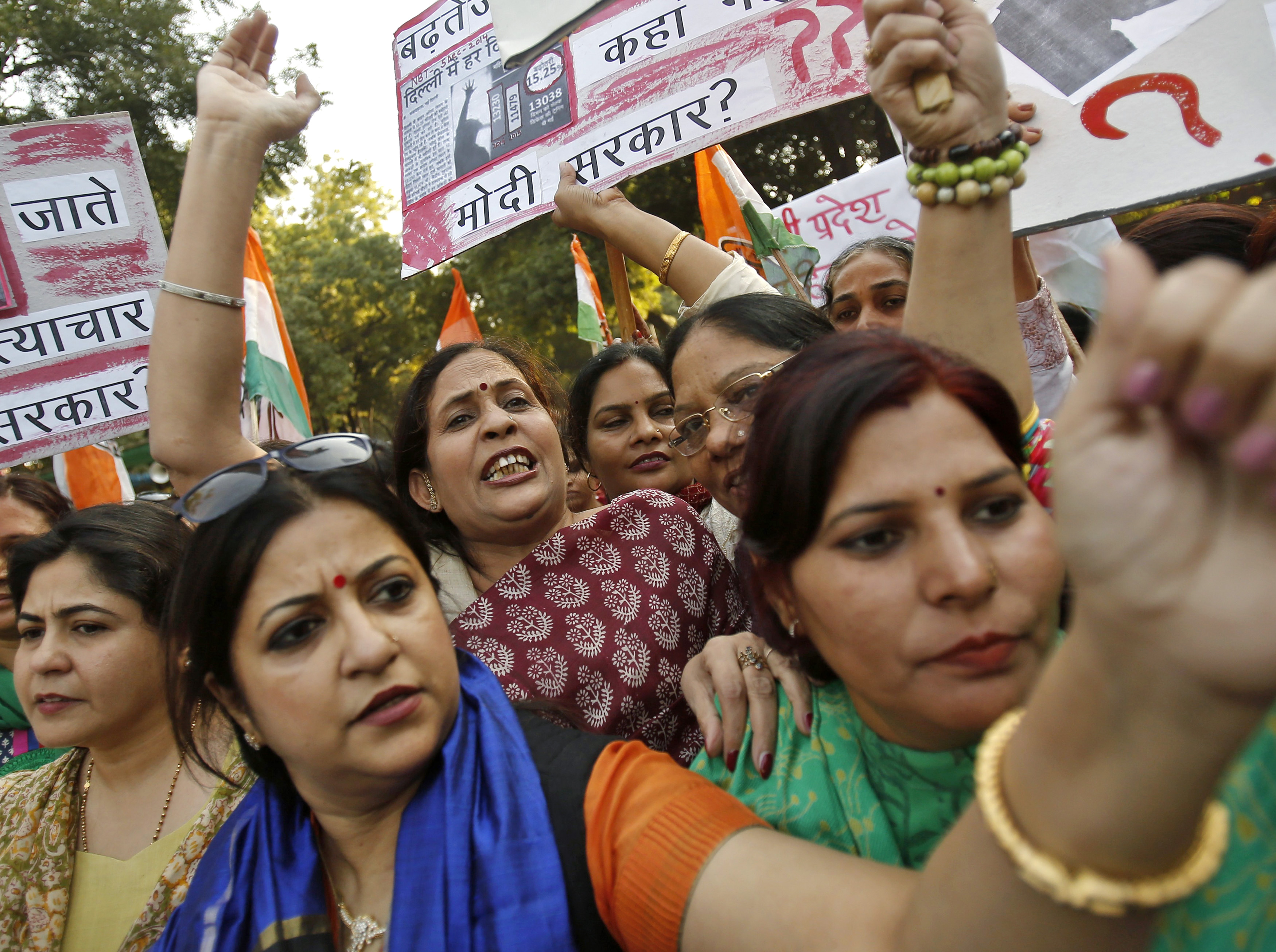 Members of All India Mahila Congress, women's wing of Congress party, shout slogans and carry placards during a protest against the rape of a female passenger, in New Delhi