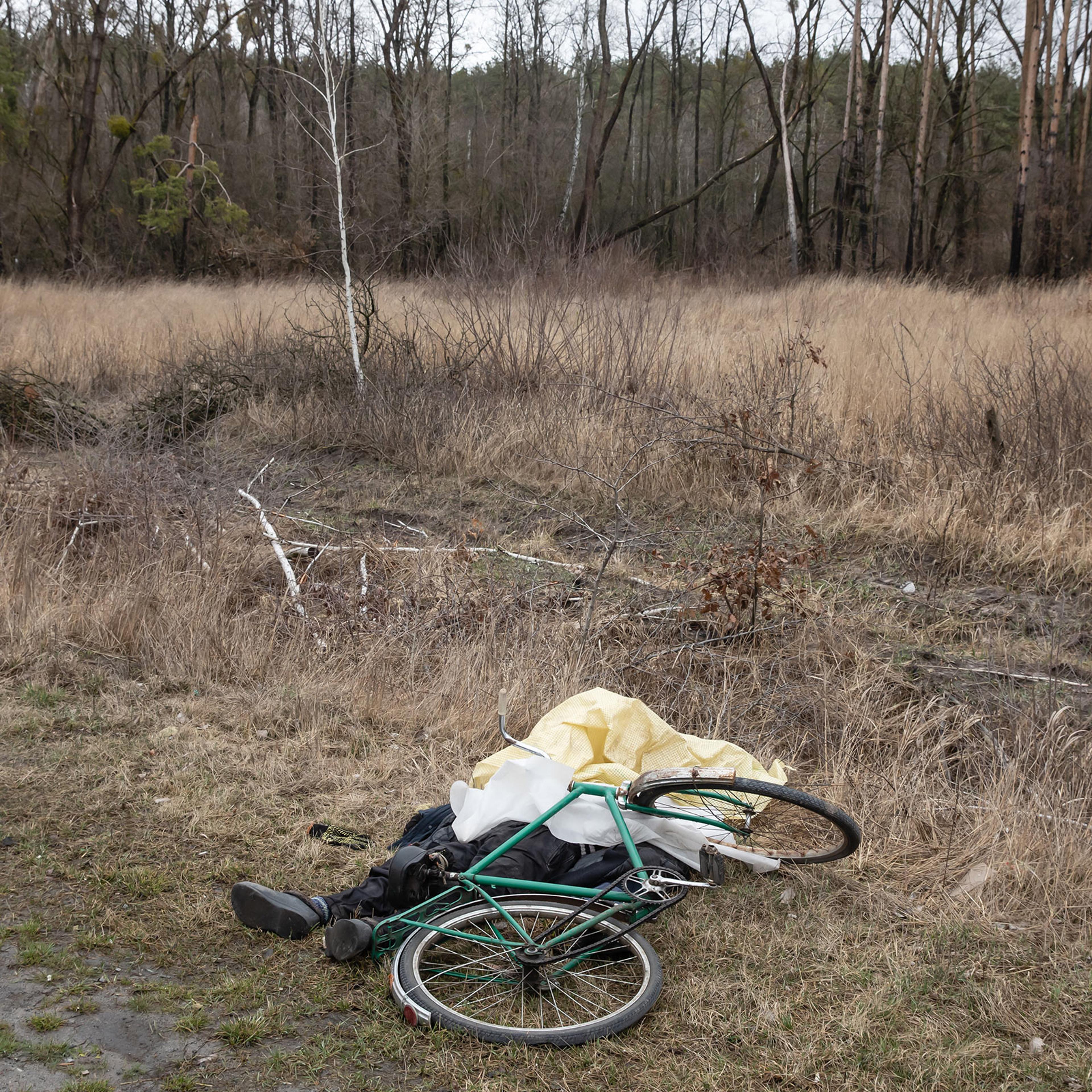 A dead civilian is seen next to his bicycle in Bucha, Ukraine, April 2, 2022.