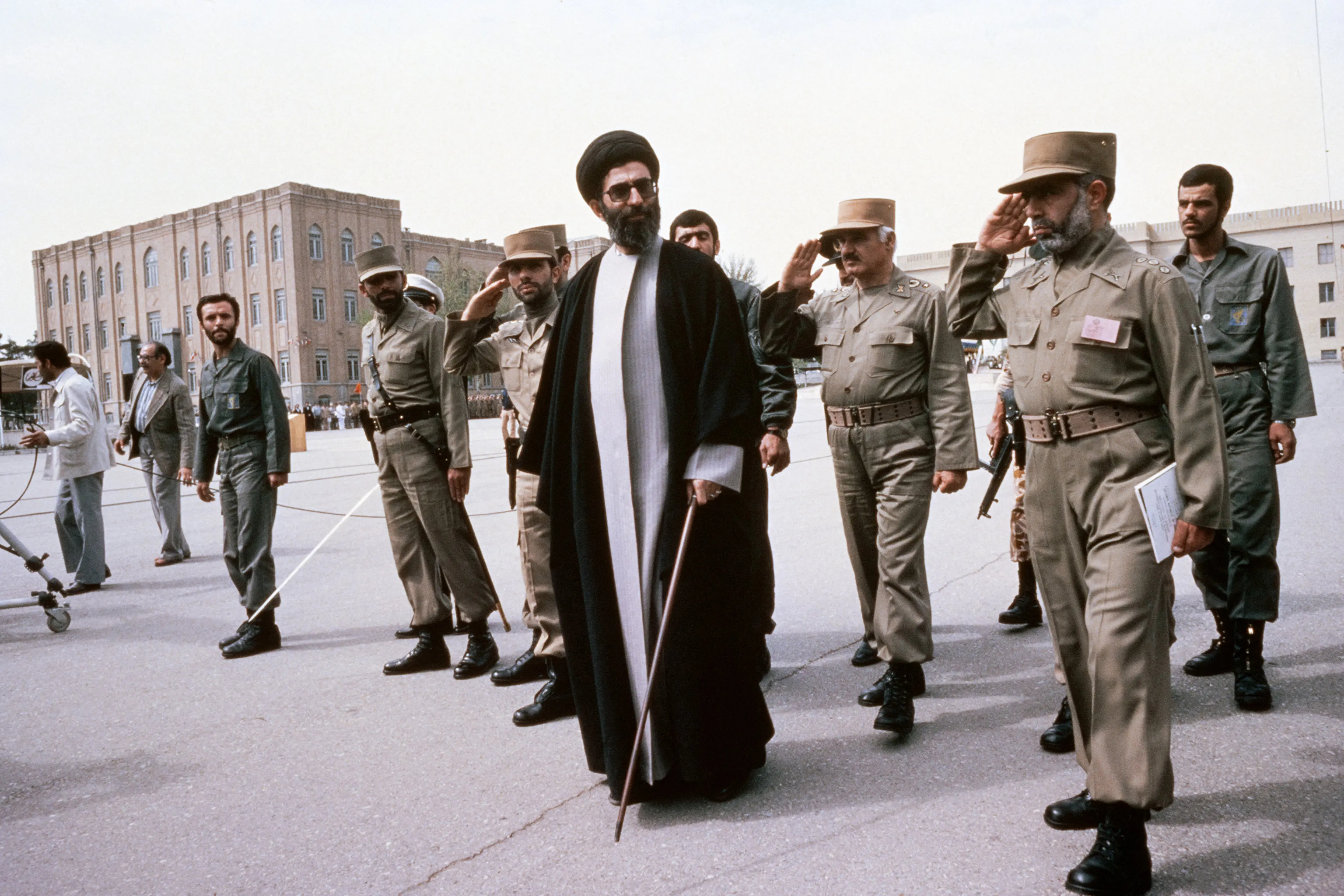 Iran's Ali Khamenei, flanked by member of the Supreme Defense Council and former commander of ground forces Ali Sayad Shirazi, reviews troops in Tehran in 1987.