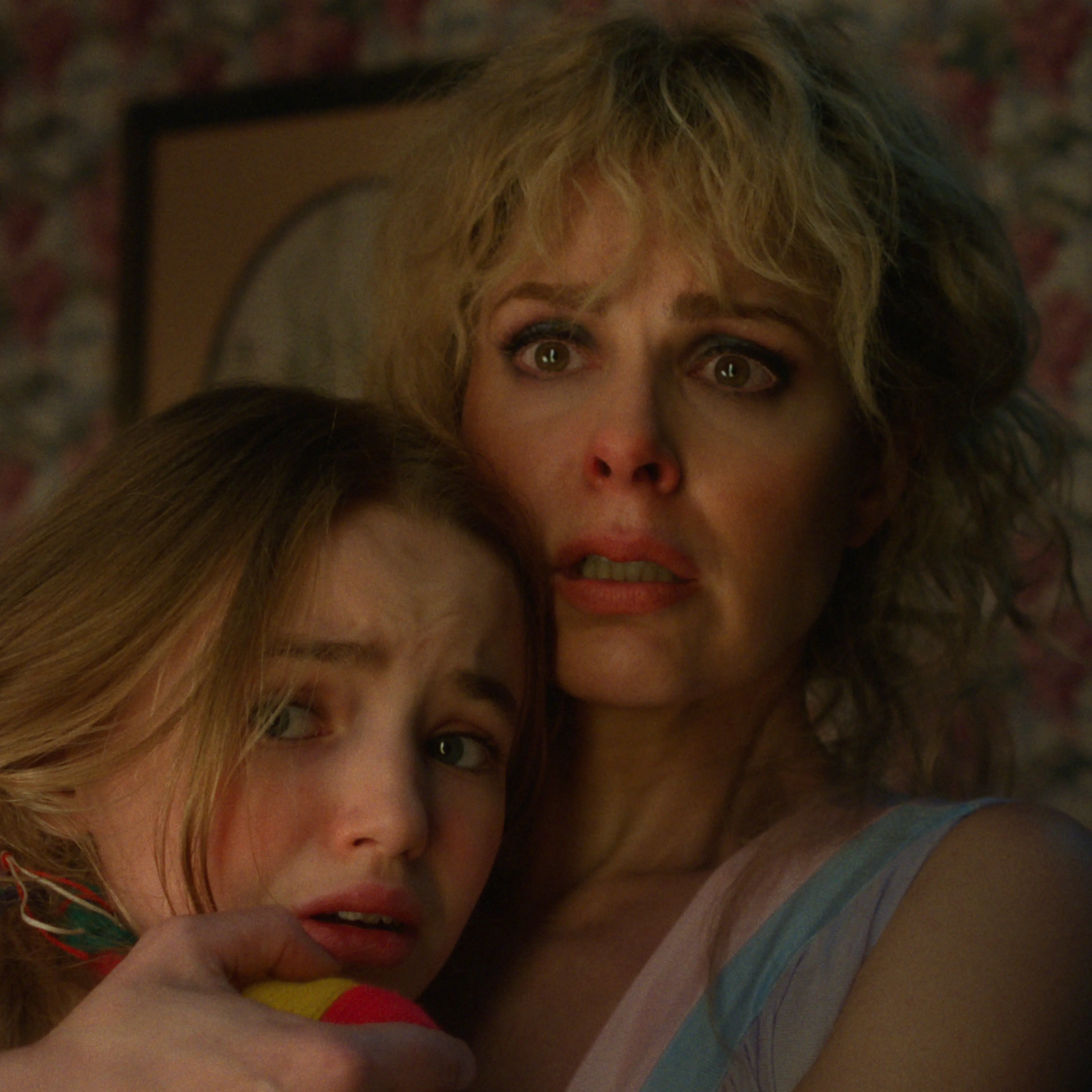 Nell Fisher as Holly Wheeler and Cara Buono as Karen Wheeler in 'Stranger Things' Season 5.