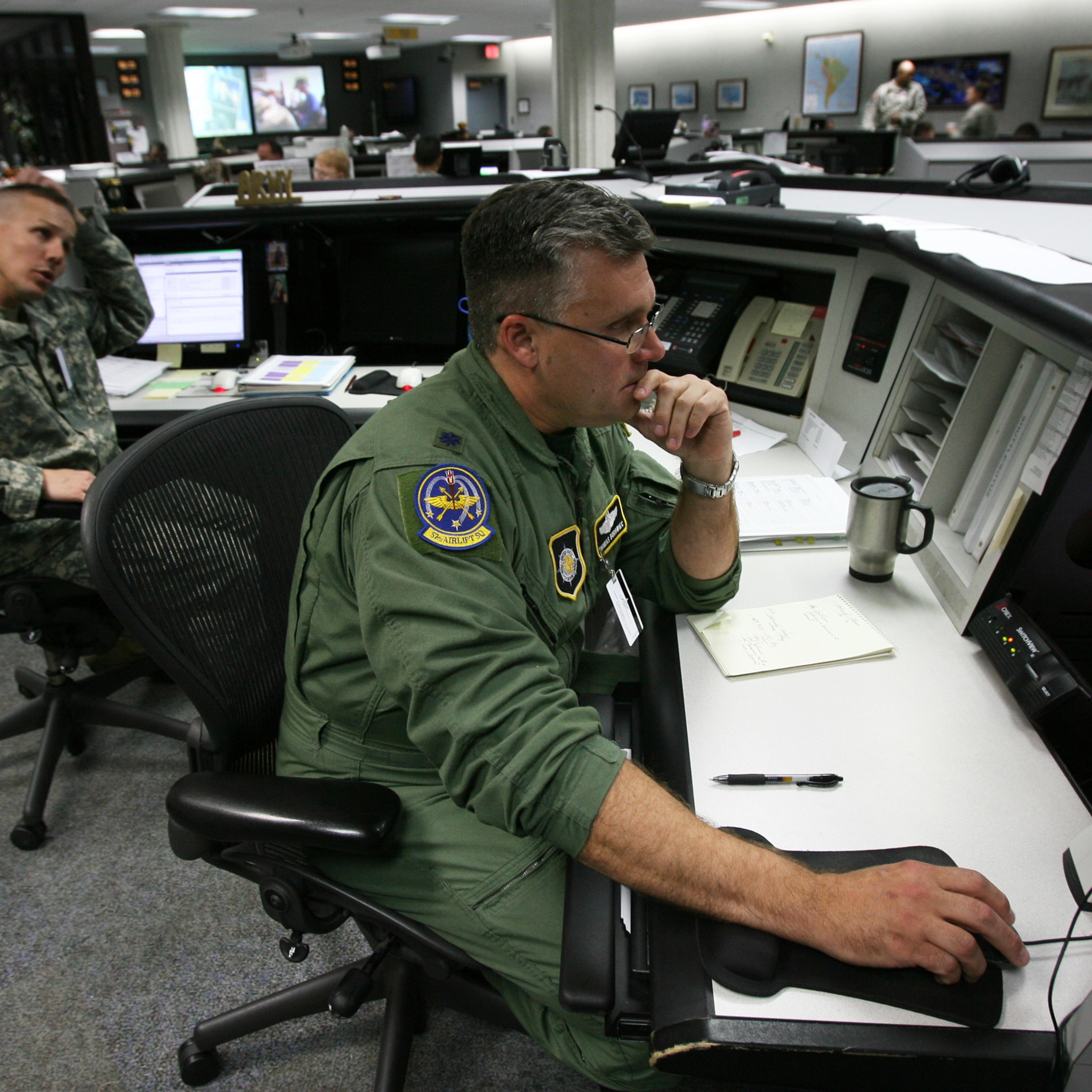 Army Lt. Col. Cecil Durbin (left) and Air Force Lt. Col Tom