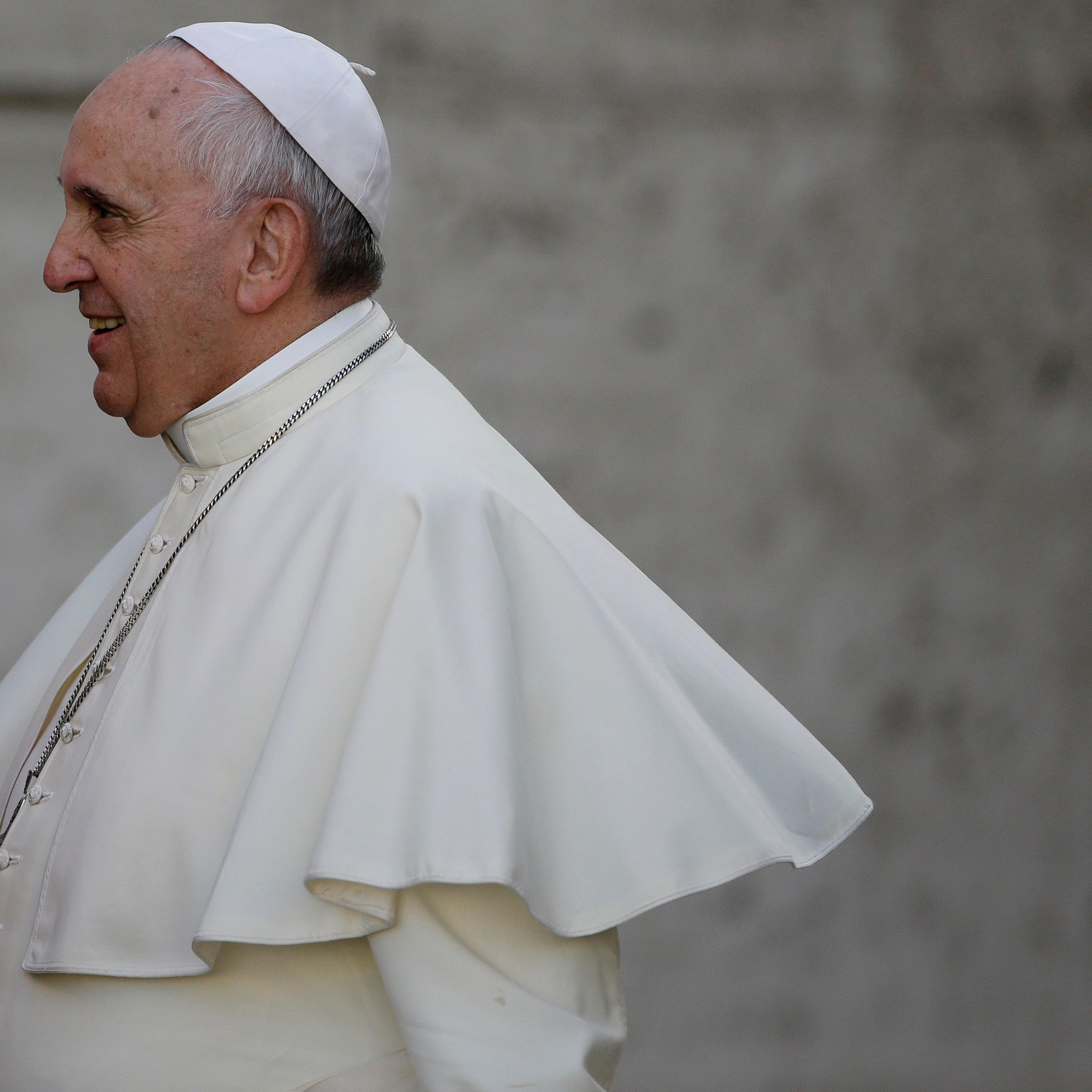 Pope Francis arrives for an afternoon session of a two-week synod on family issues at the Vatican on Oct. 9, 2014. a