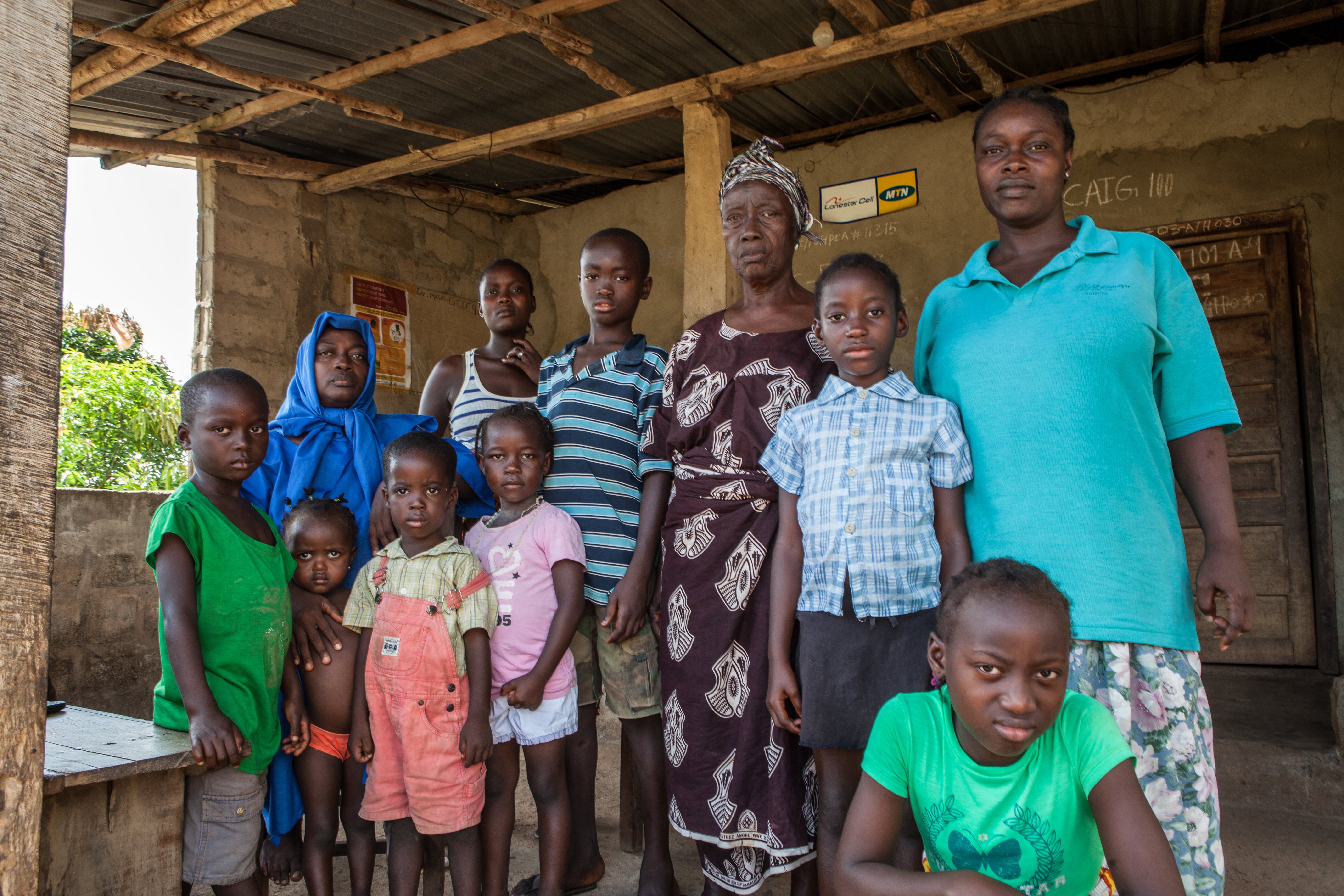 Hawa Musa with her mother and children. Of 25 people living in the house, 17 have died from ebola, including her husband.
