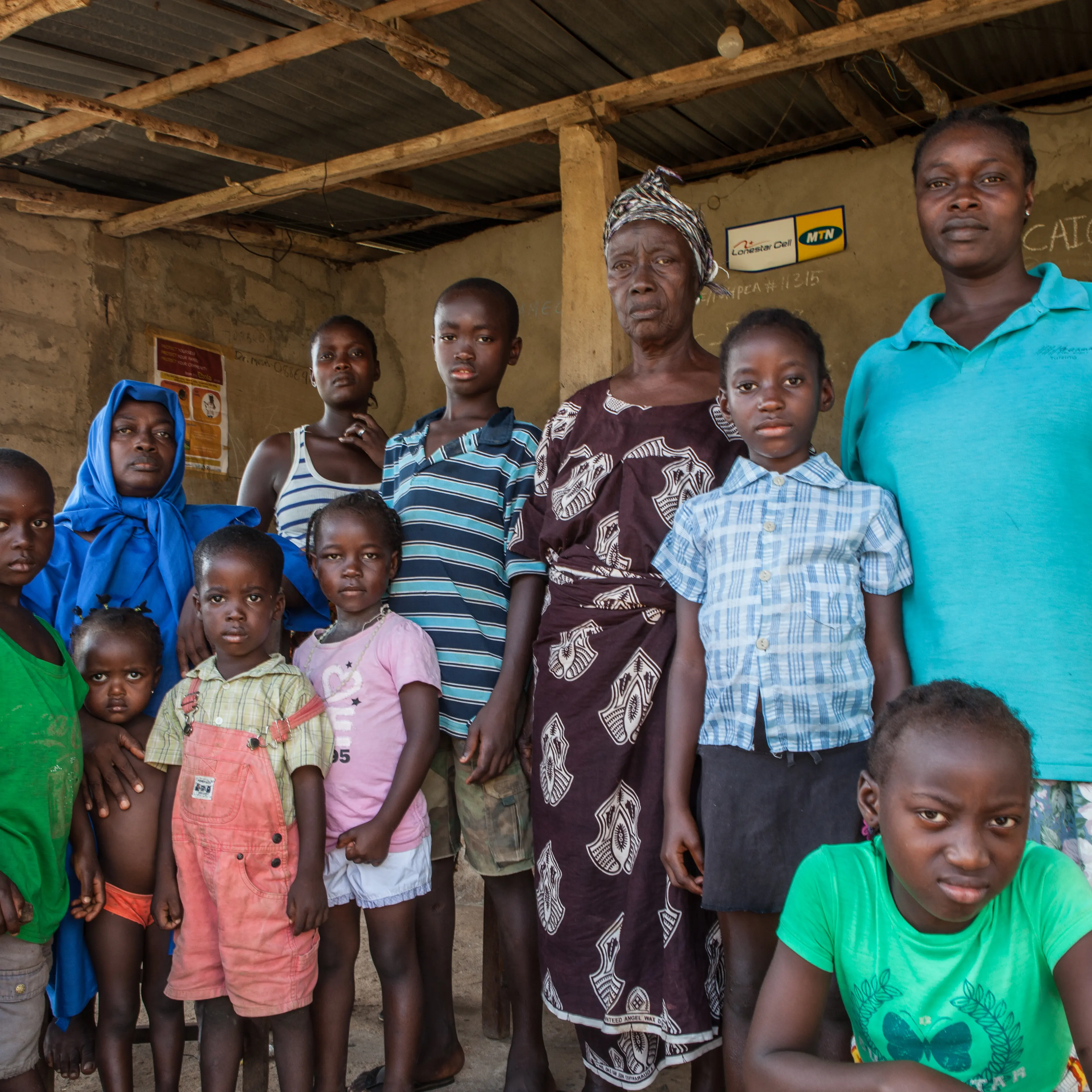 Hawa Musa with her mother and children. Of 25 people living in the house, 17 have died from ebola, including her husband.