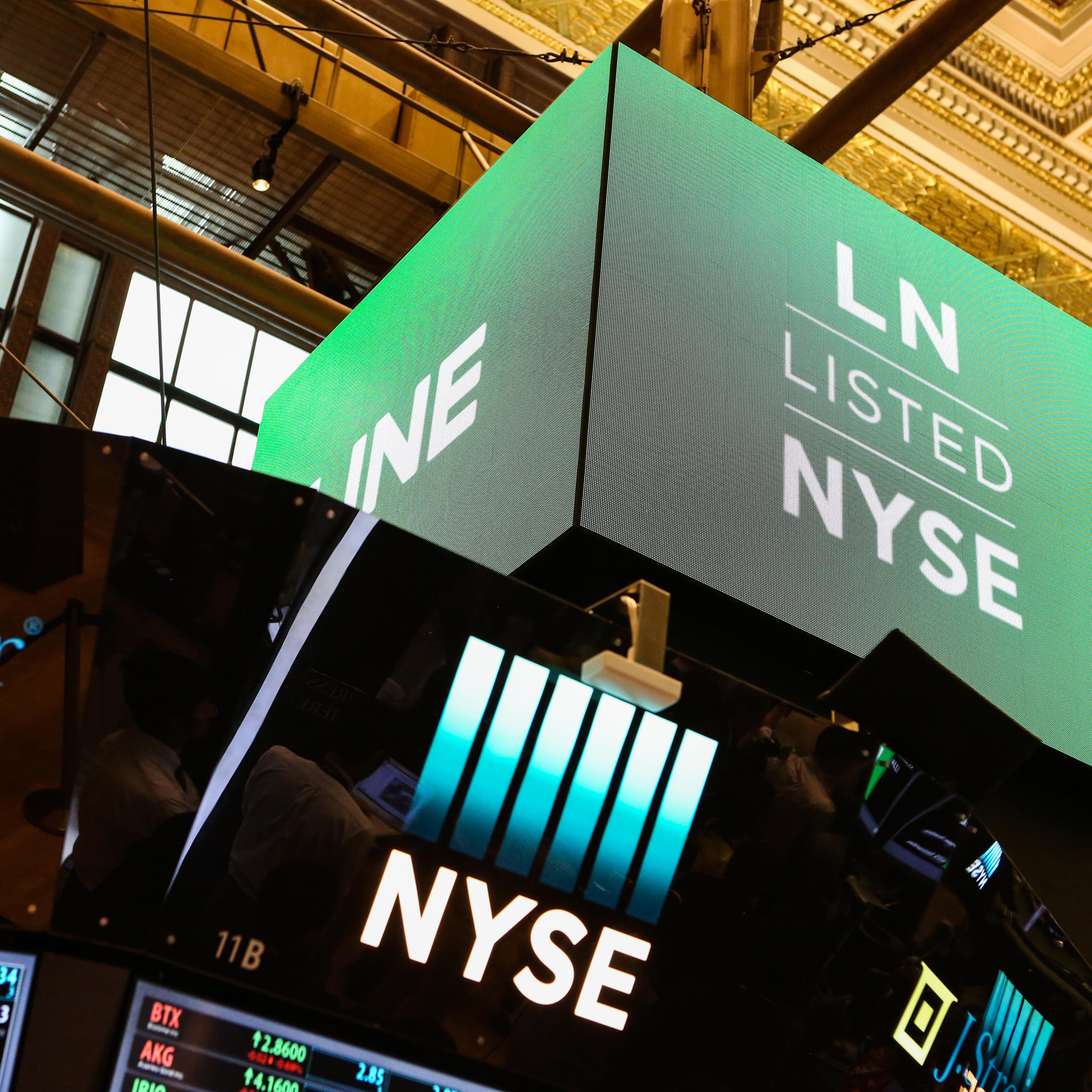 A monitor displays Line Corp. signage on the floor of the New York Stock Exchange (NYSE) in New York, U.S., on Thursday, July 14, 2016.