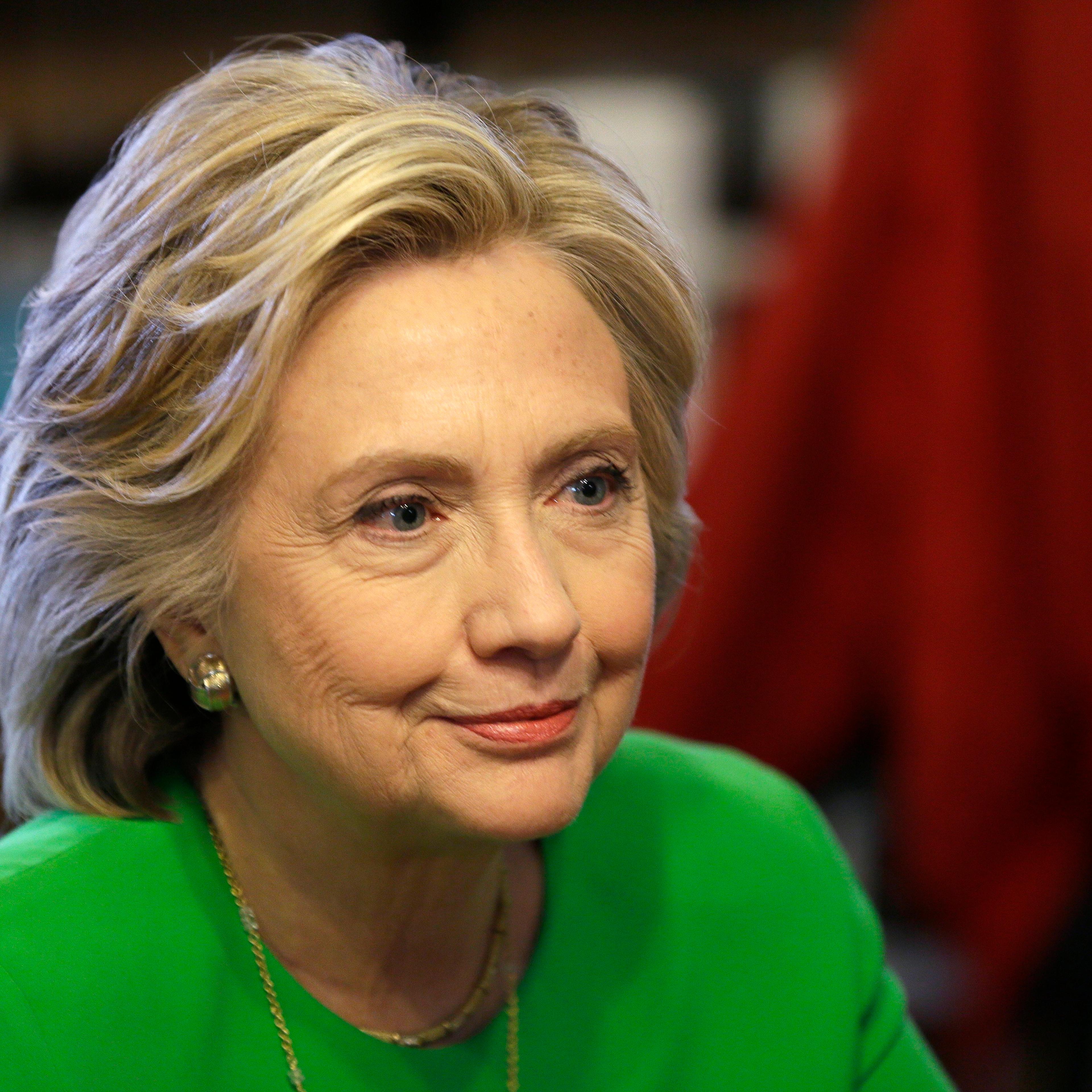 Democratic presidential candidate Hillary Rodham Clinton meets with local residents at the Jones St. Java House in LeClaire, Iowa on April 14, 2015.